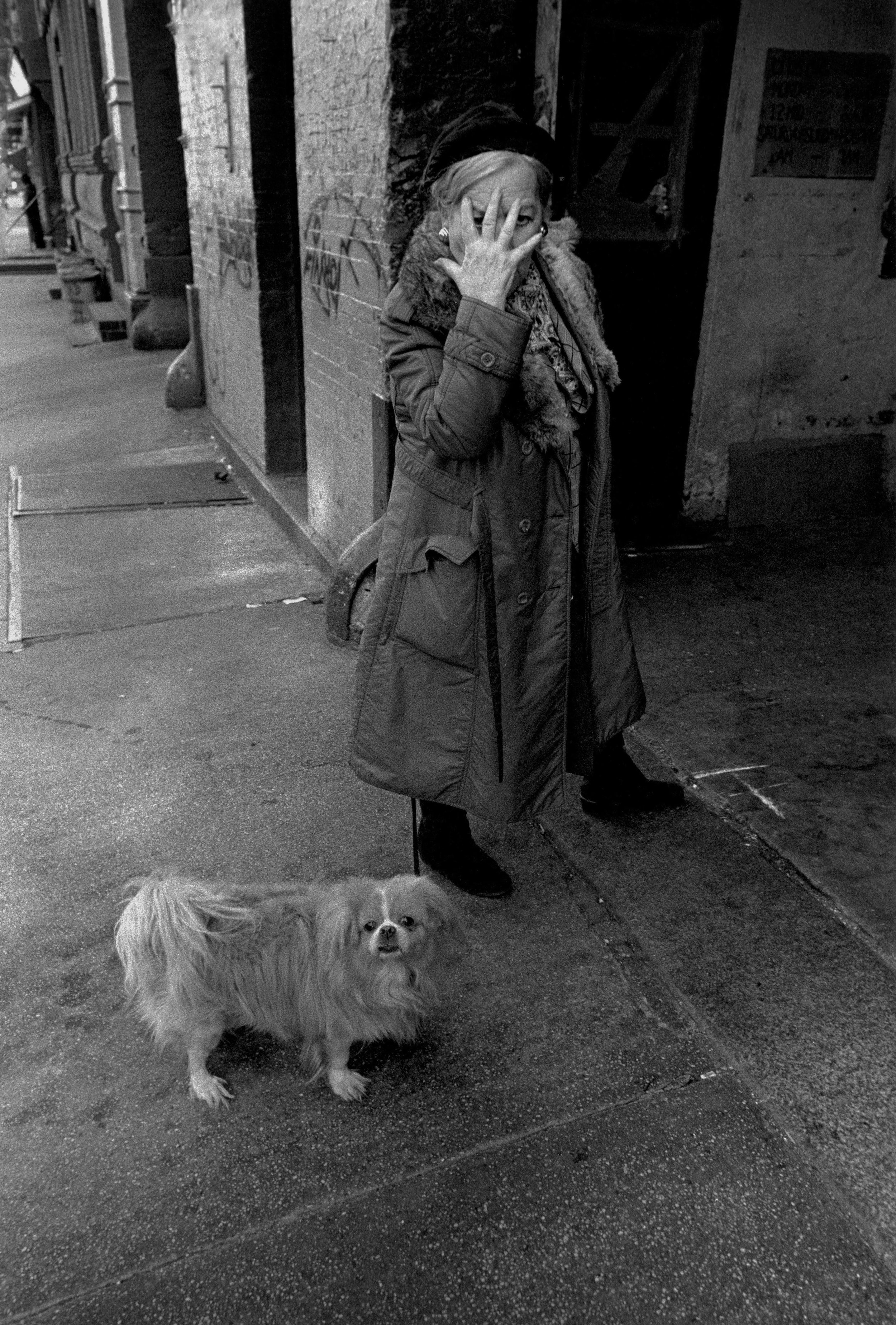 woman &amp; dog/hand on face, 11th st., nyc, c. 1981
