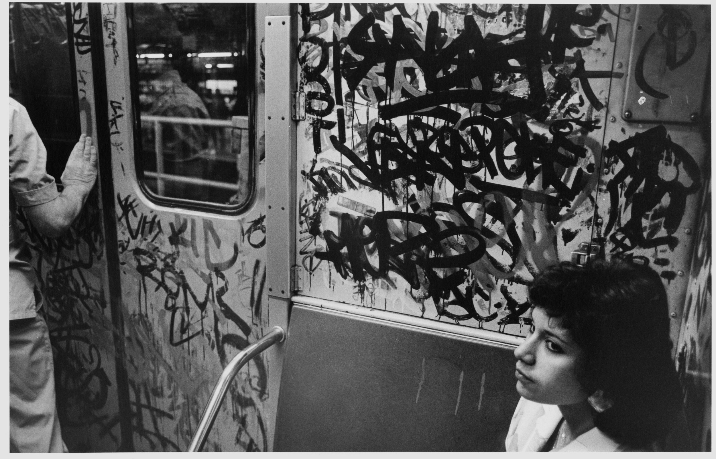 woman on train + much graff, nyc, 1985