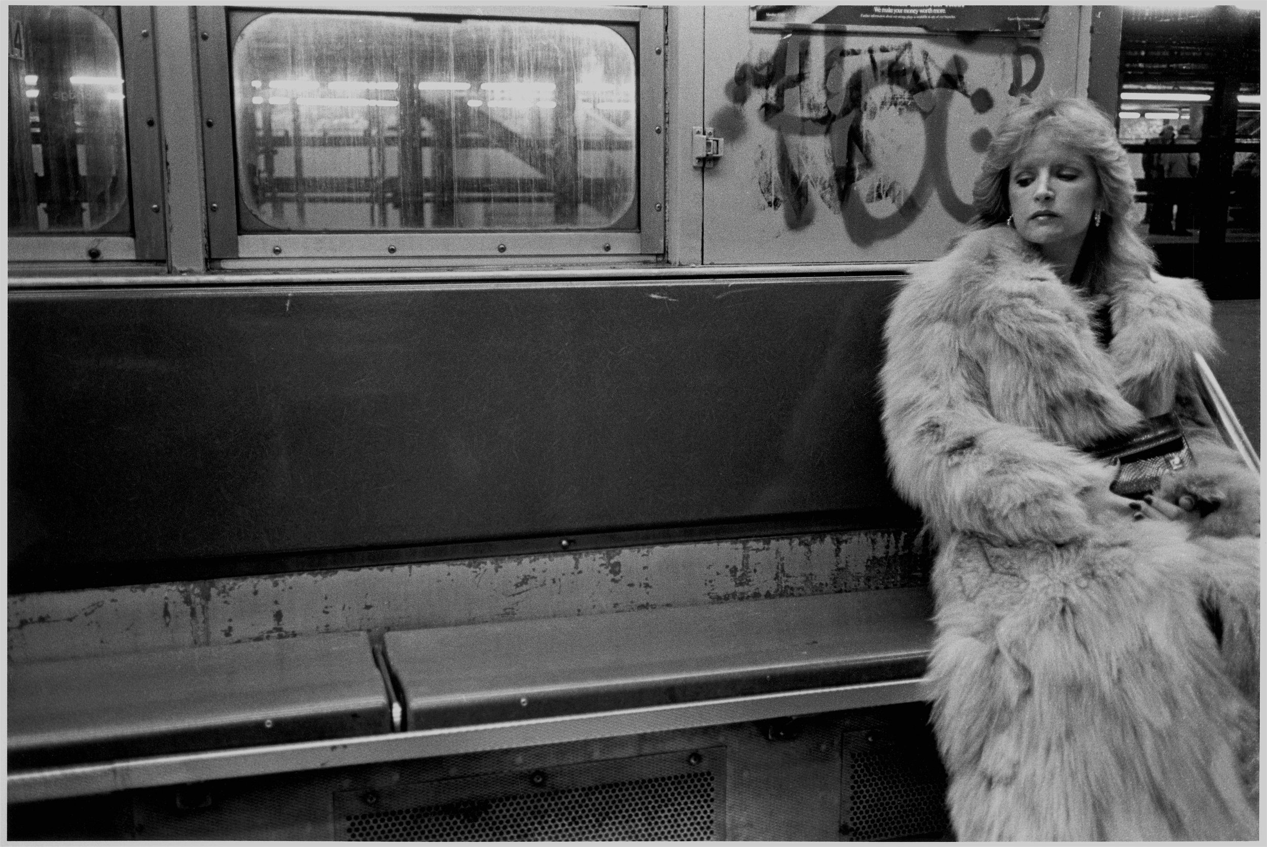 woman in white fur on irt, nyc, early 1980’s