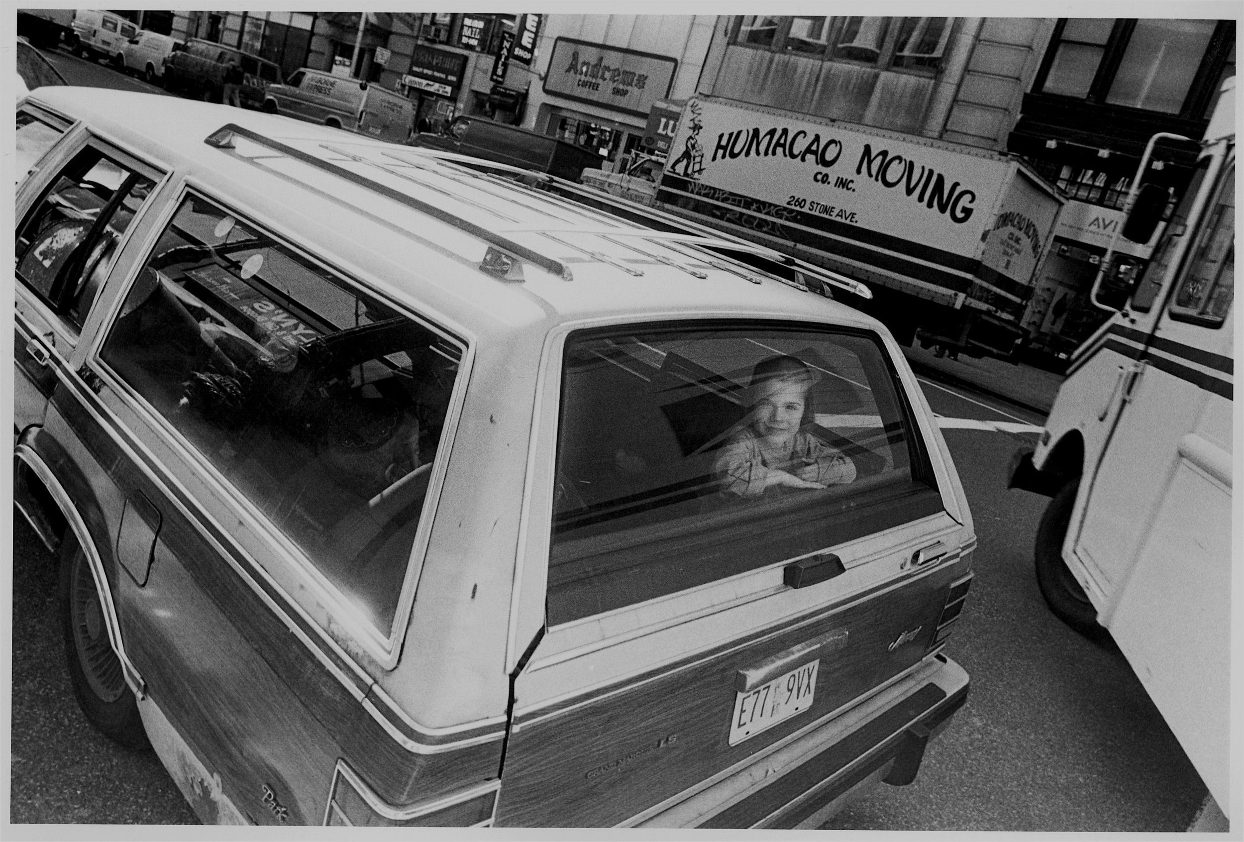 hasidic boy in back window of station wagon, nyc, c. 1993