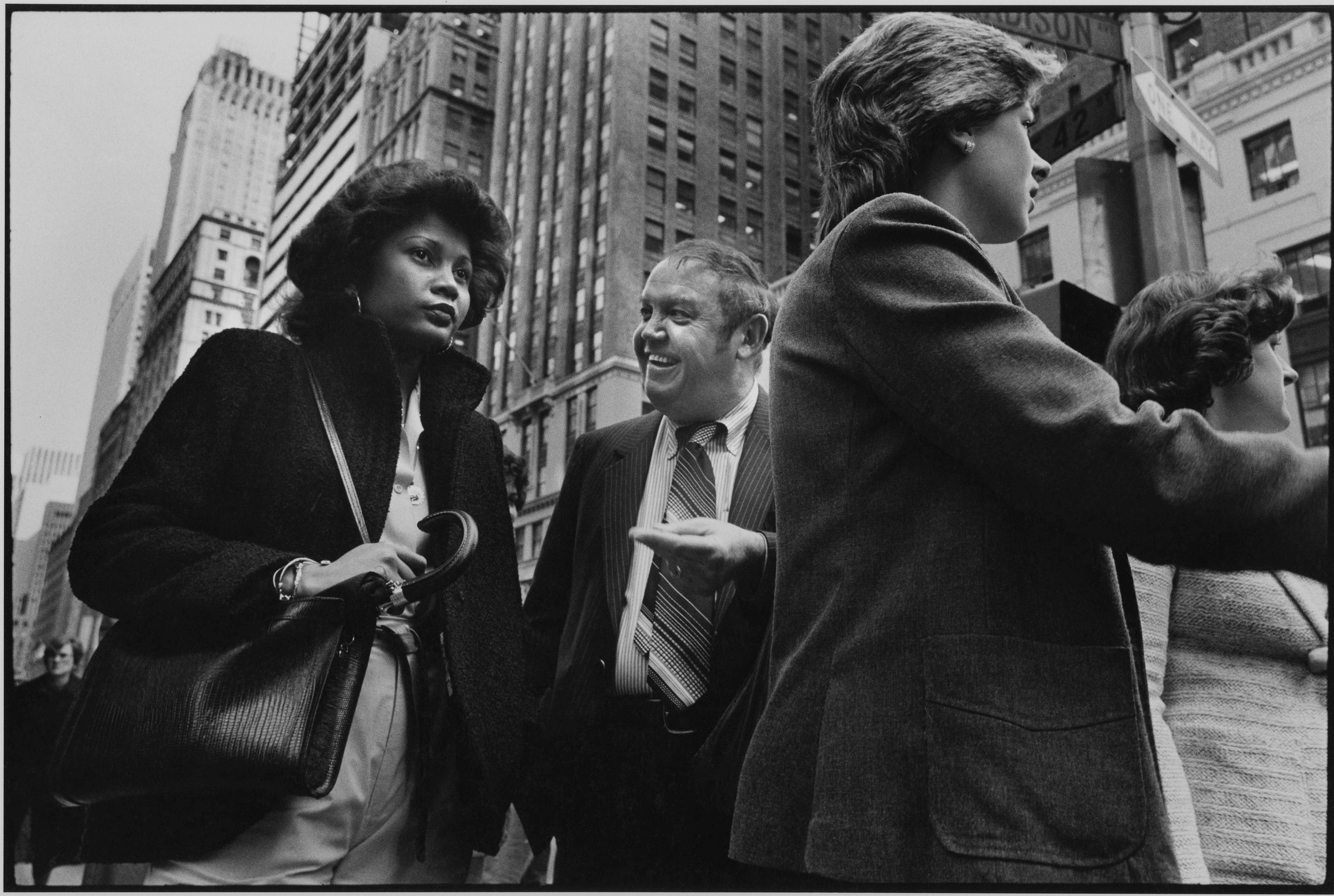 goofy white guy, stoney faced black woman, 42nd st., nyc, c. 1981