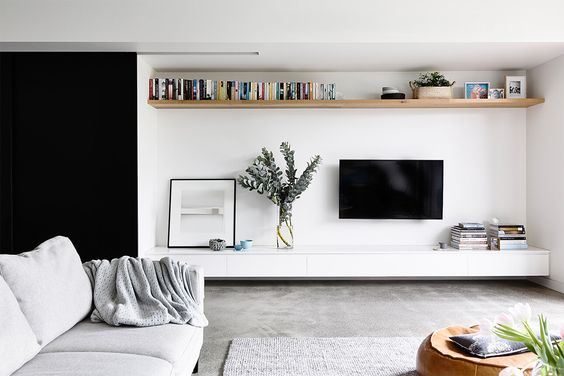 Draw the eye above the TV with an Elevated Floating Shelf | Heartly