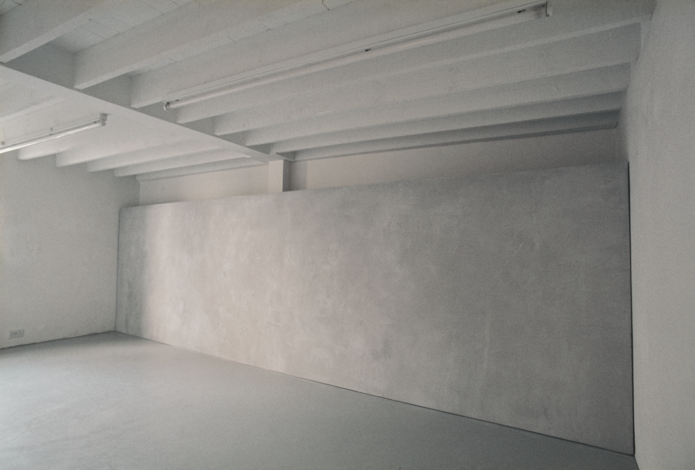 Surface: Untitled I , 1976 Grey Building Plaster on Plasterboard with Galvanised Beading 183cm (72") x 620cm (244") Installation at Lisson Gallery, London