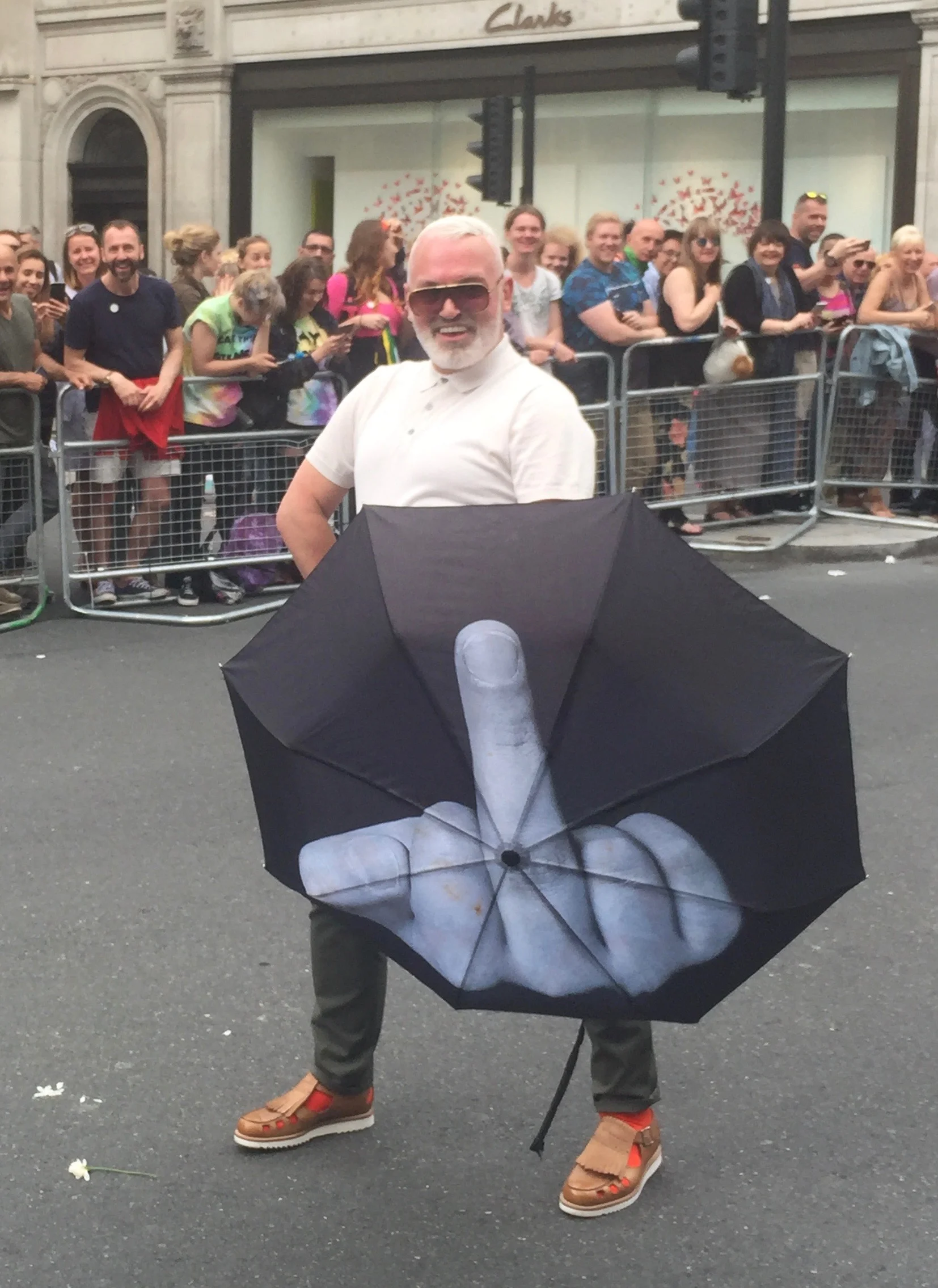 Guy with "finger' umbrella at London's Pride Parade 2016