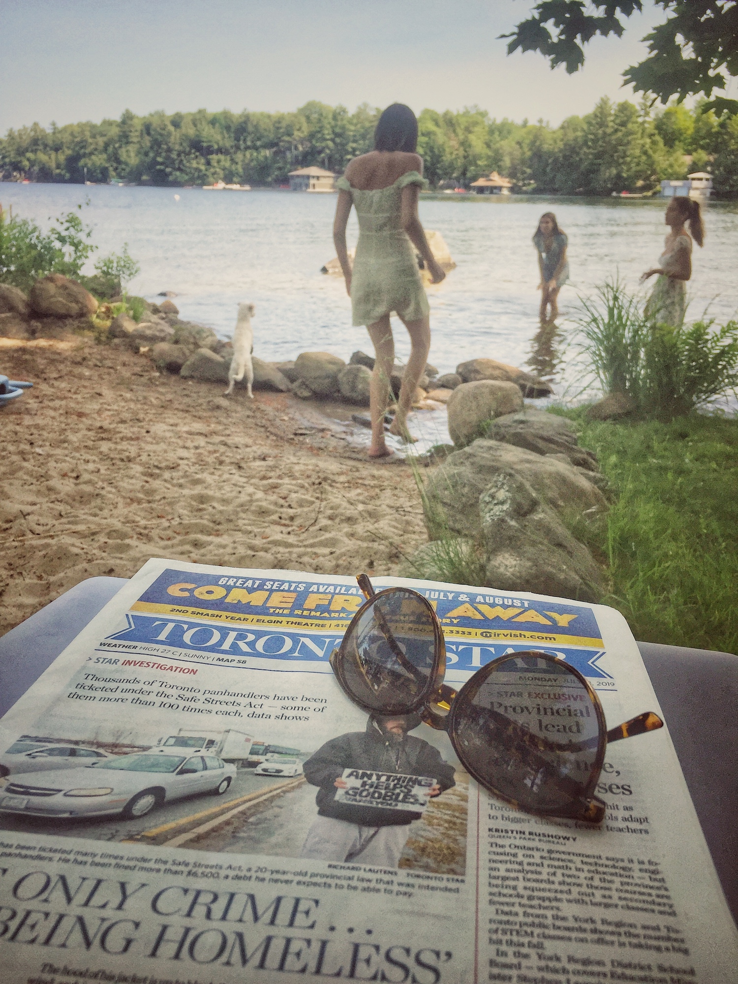 Reading the paper by the lake .jpg