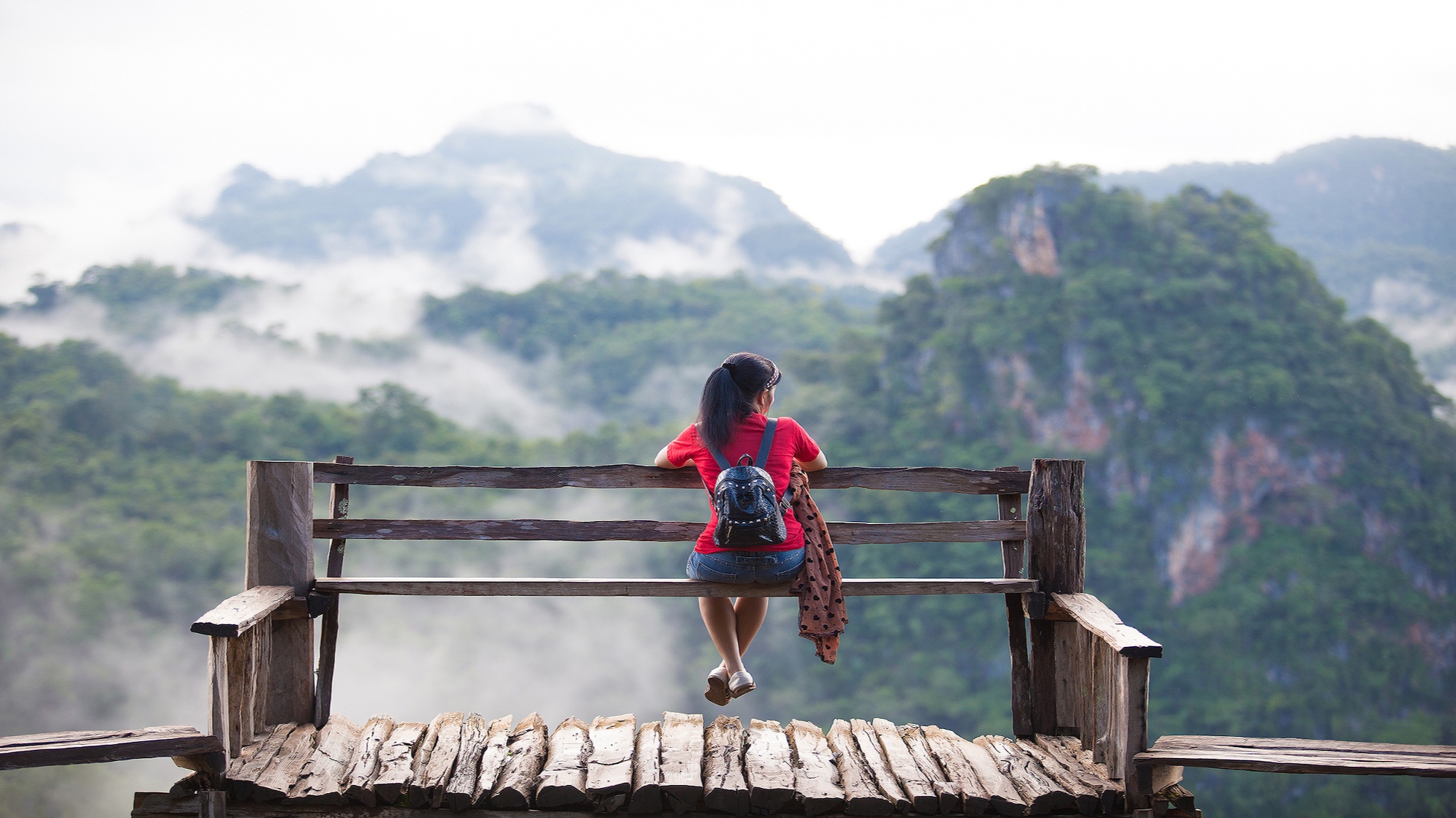 solo-travel+women+overlooking+mountains.jpg