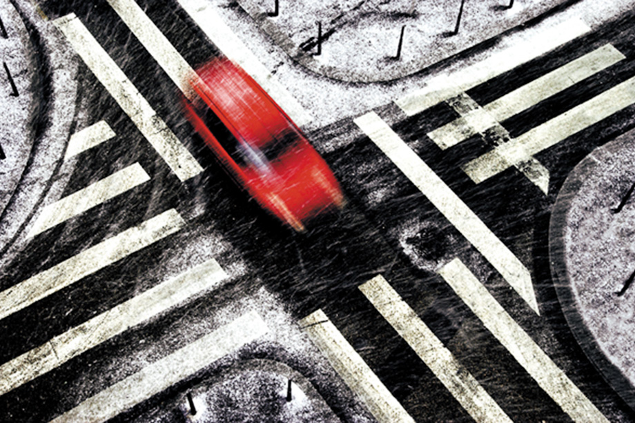 Red car in snow by Bryan Peterson