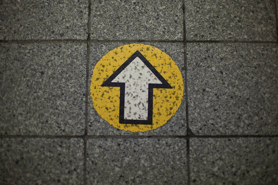 Yellow arrow at Shibuya Station in Tokyo, Japan
