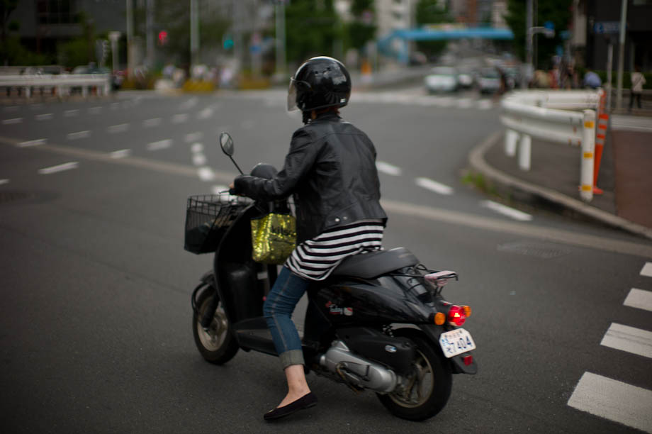 Girl on a moped in Nakameguro, Tokyo, Japan