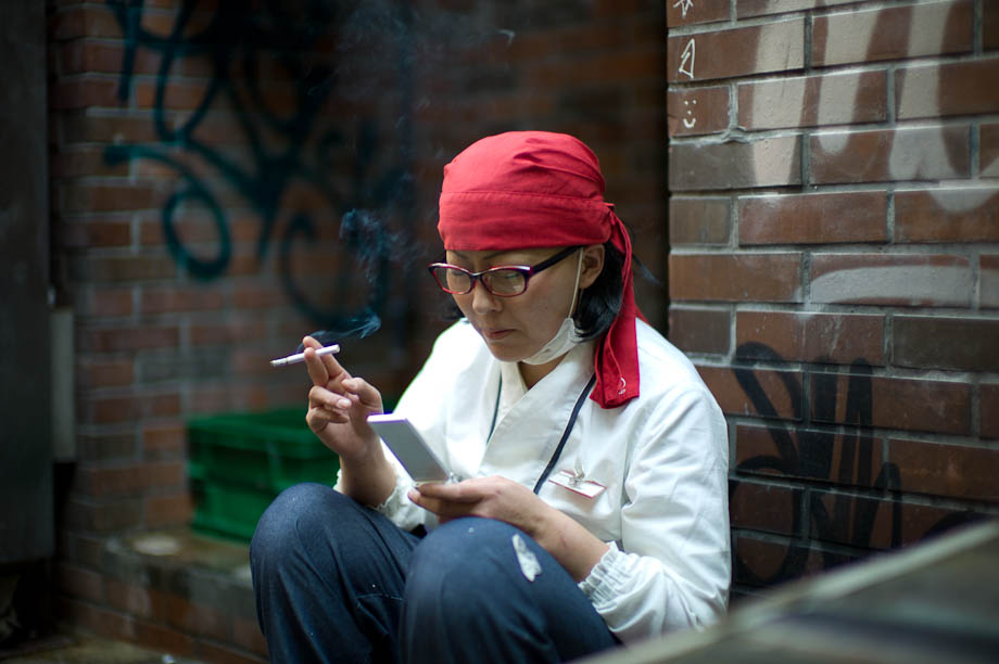 Checking news on Mobile Phone in Shibuya
