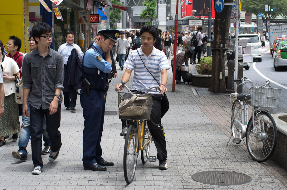 Cops checking bikes in Shibuya