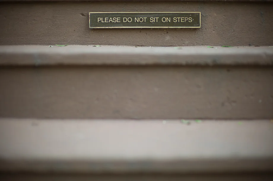 Please do not sit on the steps on Newbury Street in Boston
