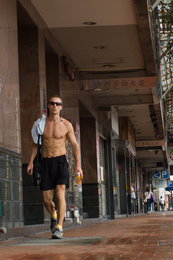 Man running in Causeway Bay in Hong Kong