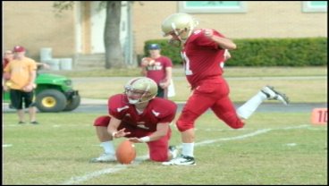 Tom Thompson (R) makes his history-making kick in 2009. (Austin College photo) 