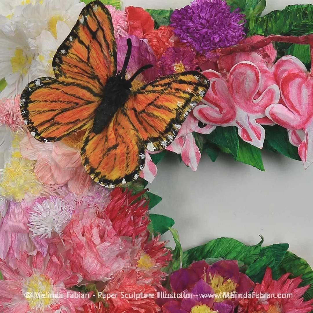 detail view of paper monarch butterfly and flowers