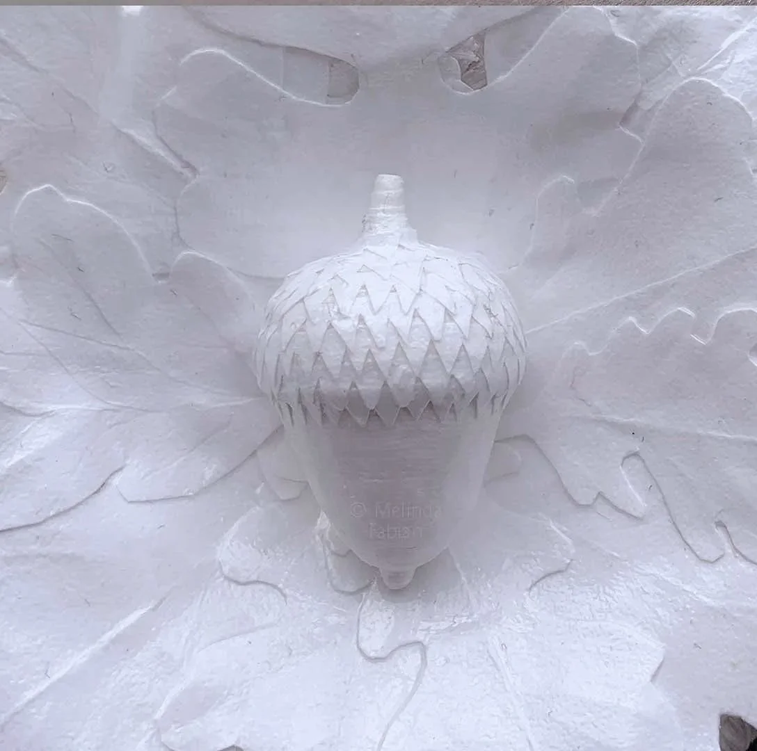Close-Up-View of the white acorn and leaves - all handmade paper sculpture by Melinda Fabian
