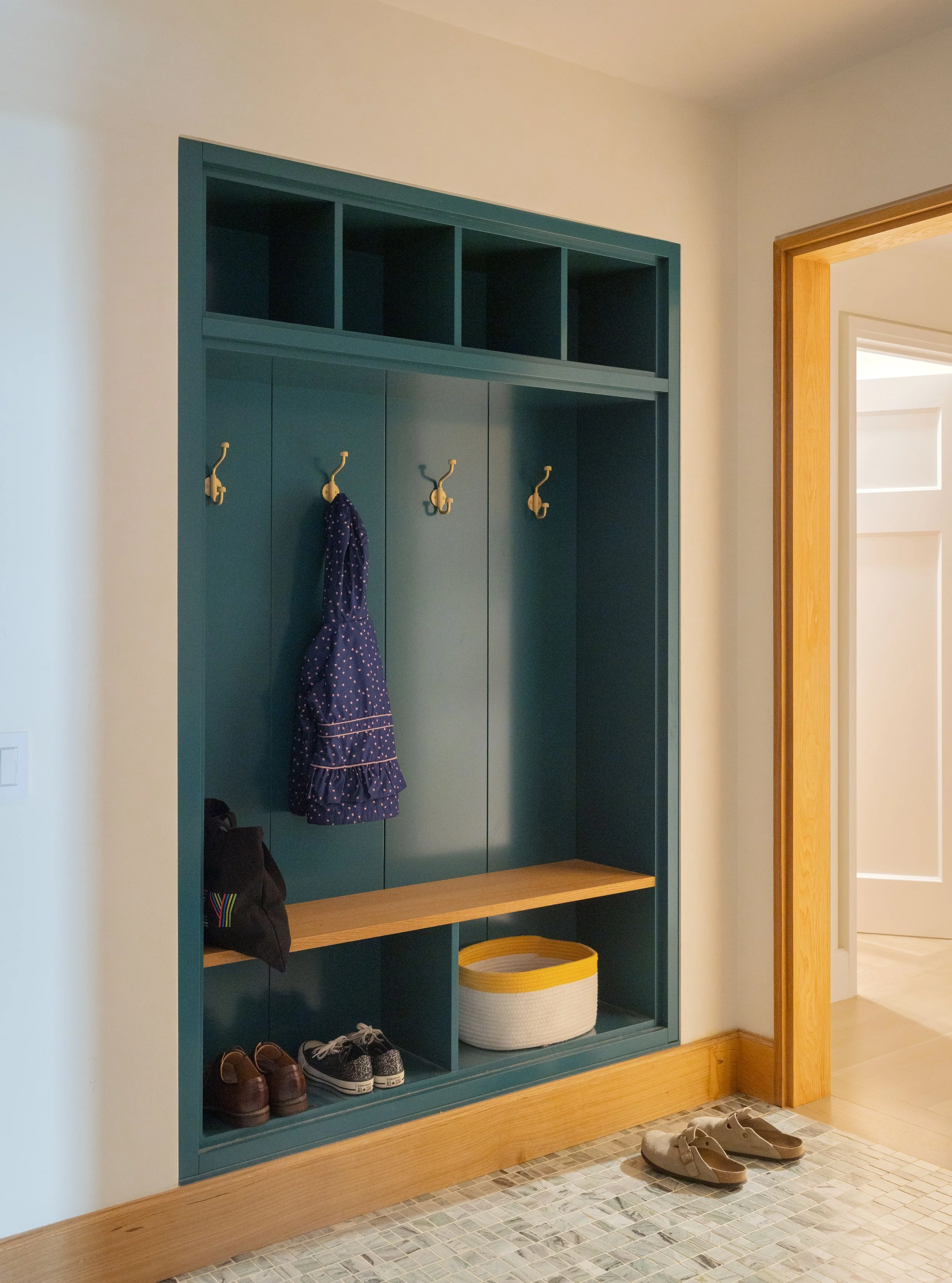 Entry built in custom storage millwork
