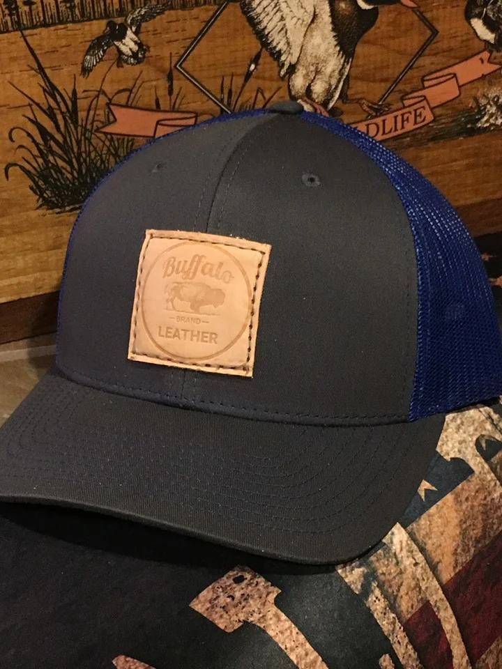 grey and blue Buffalo brand leather hat
