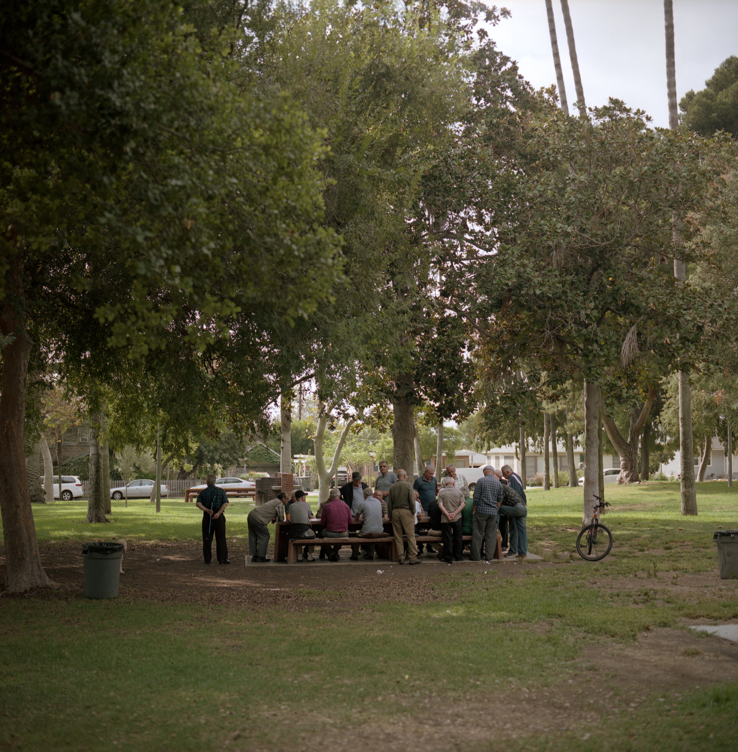  A group of Armenian Americans play backgammon at Fremont Park. Over the years, the park has served as a gathering space for many old Armenian men to play games, barbecue, and spend the afternoon together.  