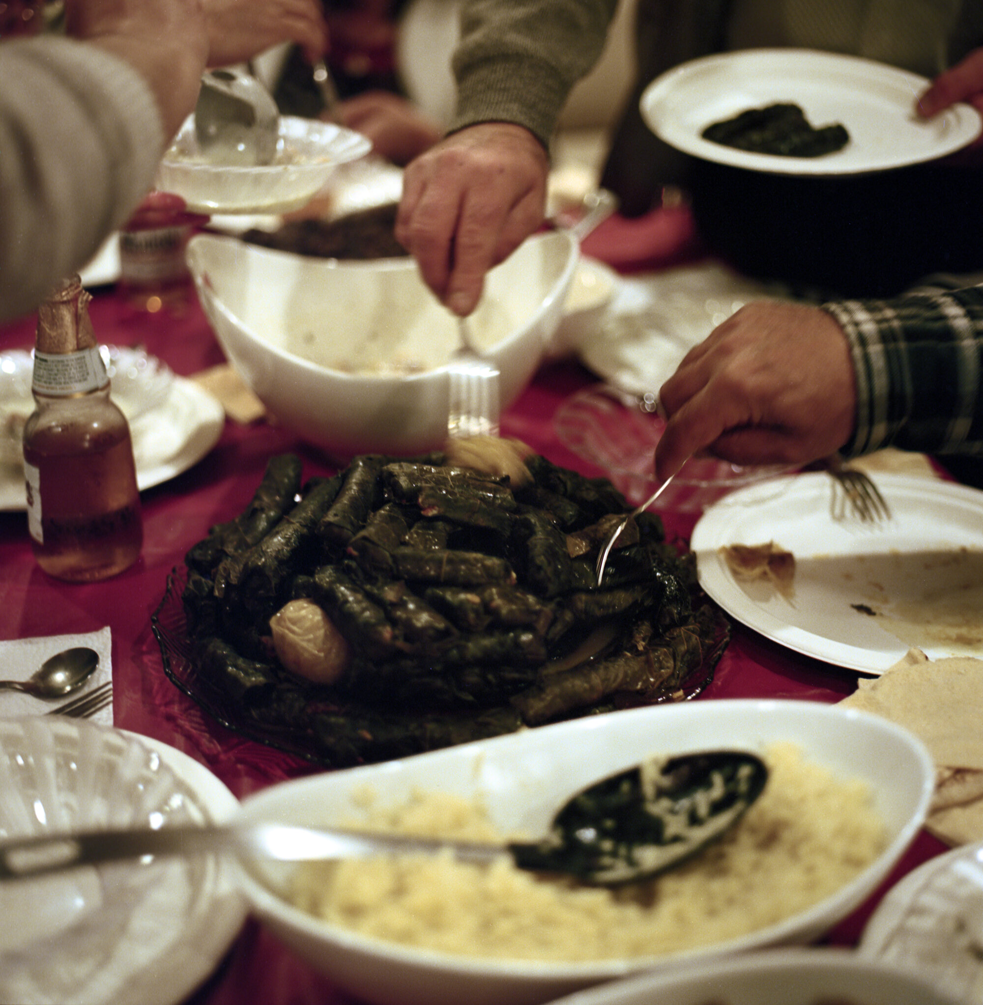  Members of the Charshafjian, Hallajian, and Tavitian families reach for hand made Sarma during Easter dinner. Food is one of the main parts of diaspora communities that serve as vessels for sharing of culture. The Sarma are made of spices meat and r