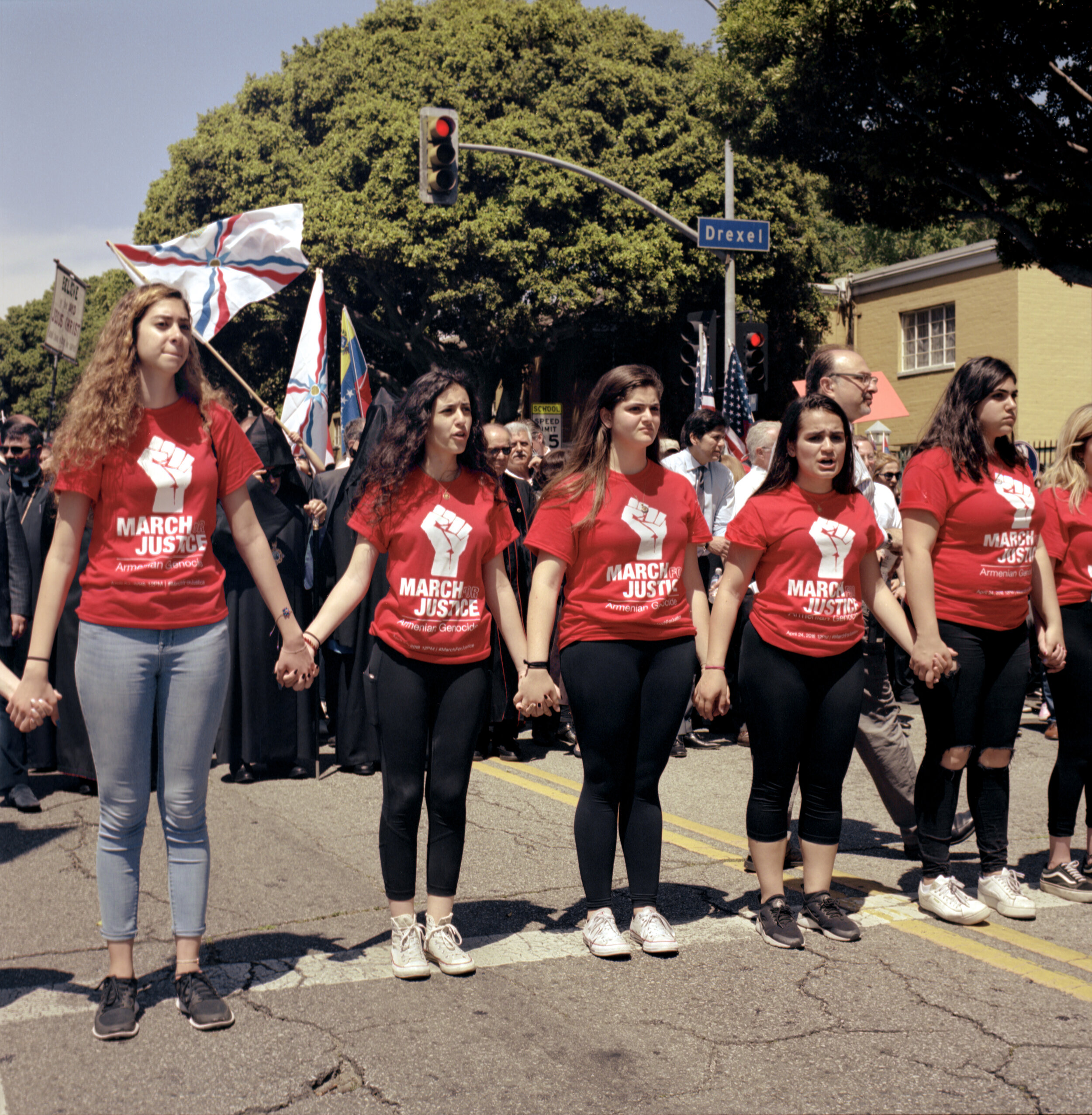  A group of women hold hands at the front of a protest made up of thousands of Armenian-Americans from all over southern California on April 24th, 2018. The group marched from the Little Armenia neighborhood in Hollywood to the Turkish consulate in M
