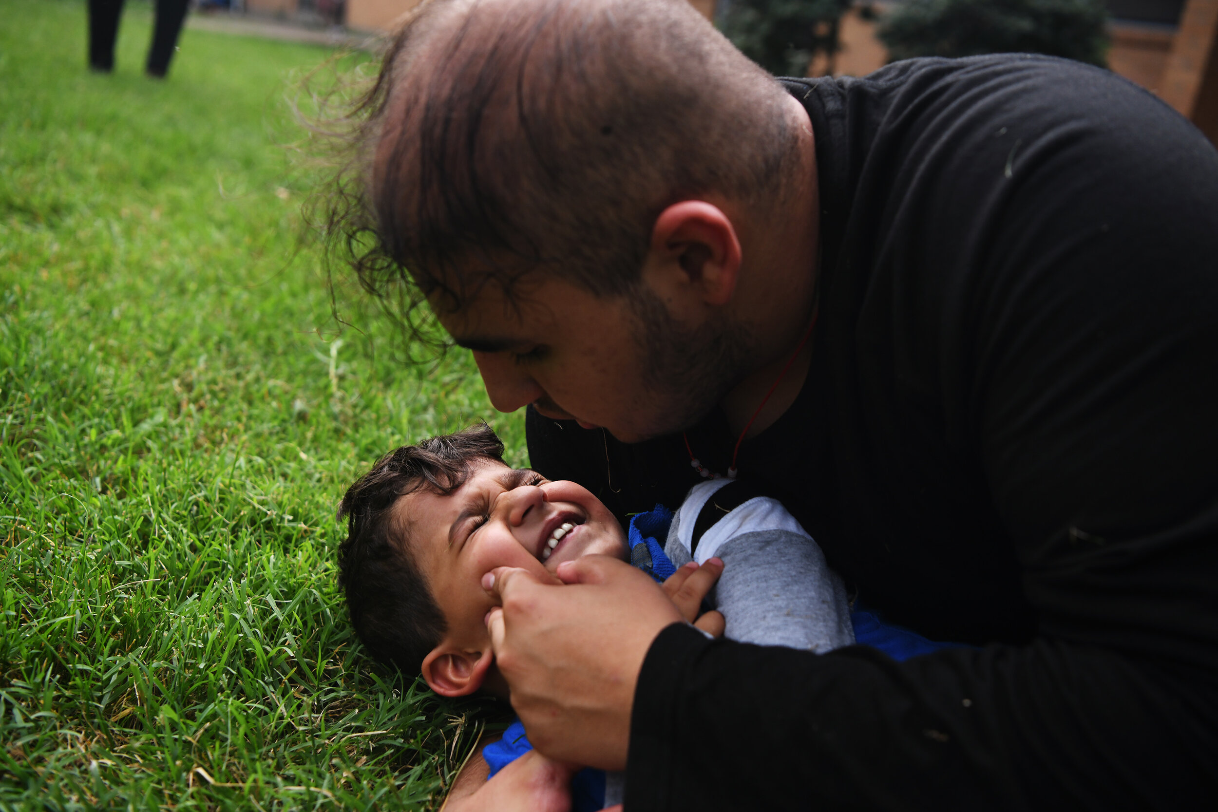  Abbas plays with his youngest brother, Baqer, 4,  on Thursday, August, 29, 2019, outside their home in Columbia, Mo. While their father is away for most of the year, Abbas takes over as the father figure of the family. “He’s my favorite because we’r