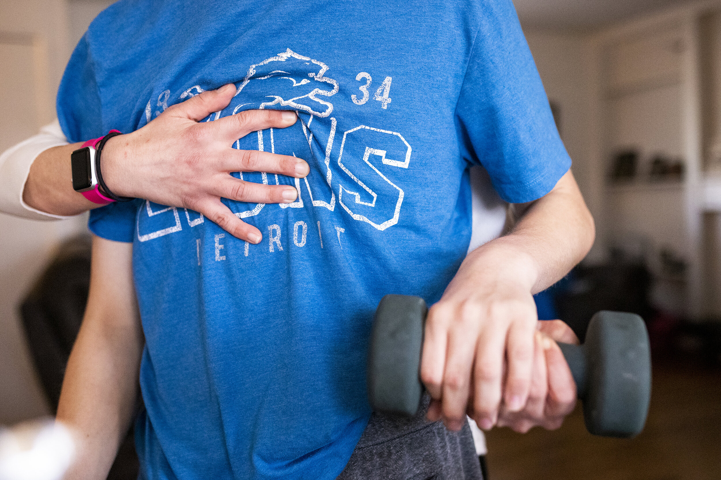  Danielle Vernon-Carleton helps her step-son Jackson Carleton, 16, lift weights for a physical therapy class on Monday, March 7, 2021, in Troy. Danielle had to resign from her job as a teacher in order to help teach her three step-sons with special n