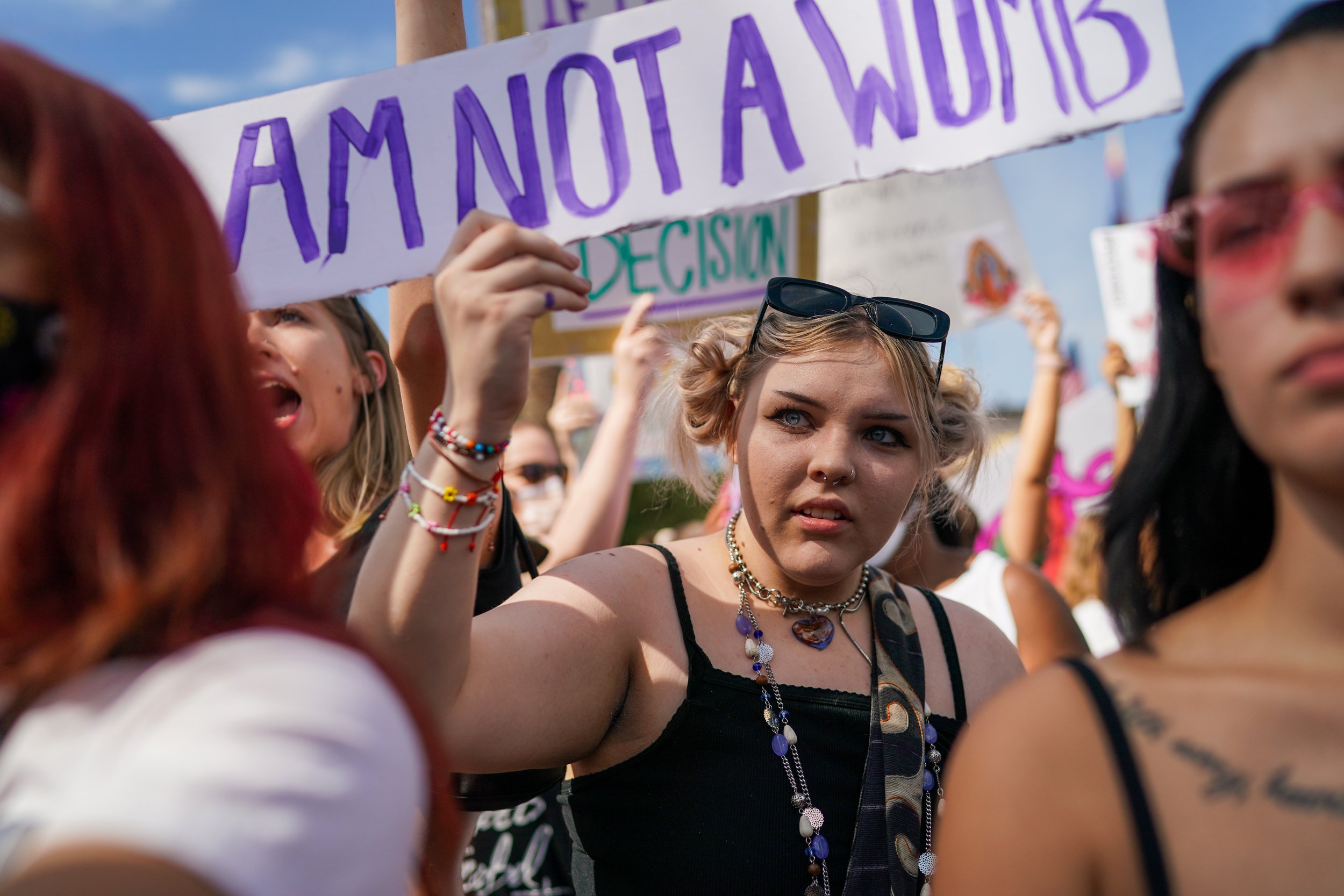  Hope Deaver, center, chants along with fellow protestors in opposition to a small group of anti-abortion protestors during the annual WomenÕs March at the Arizona State Capitol on Saturday, October 2, 2021, in Phoenix.         