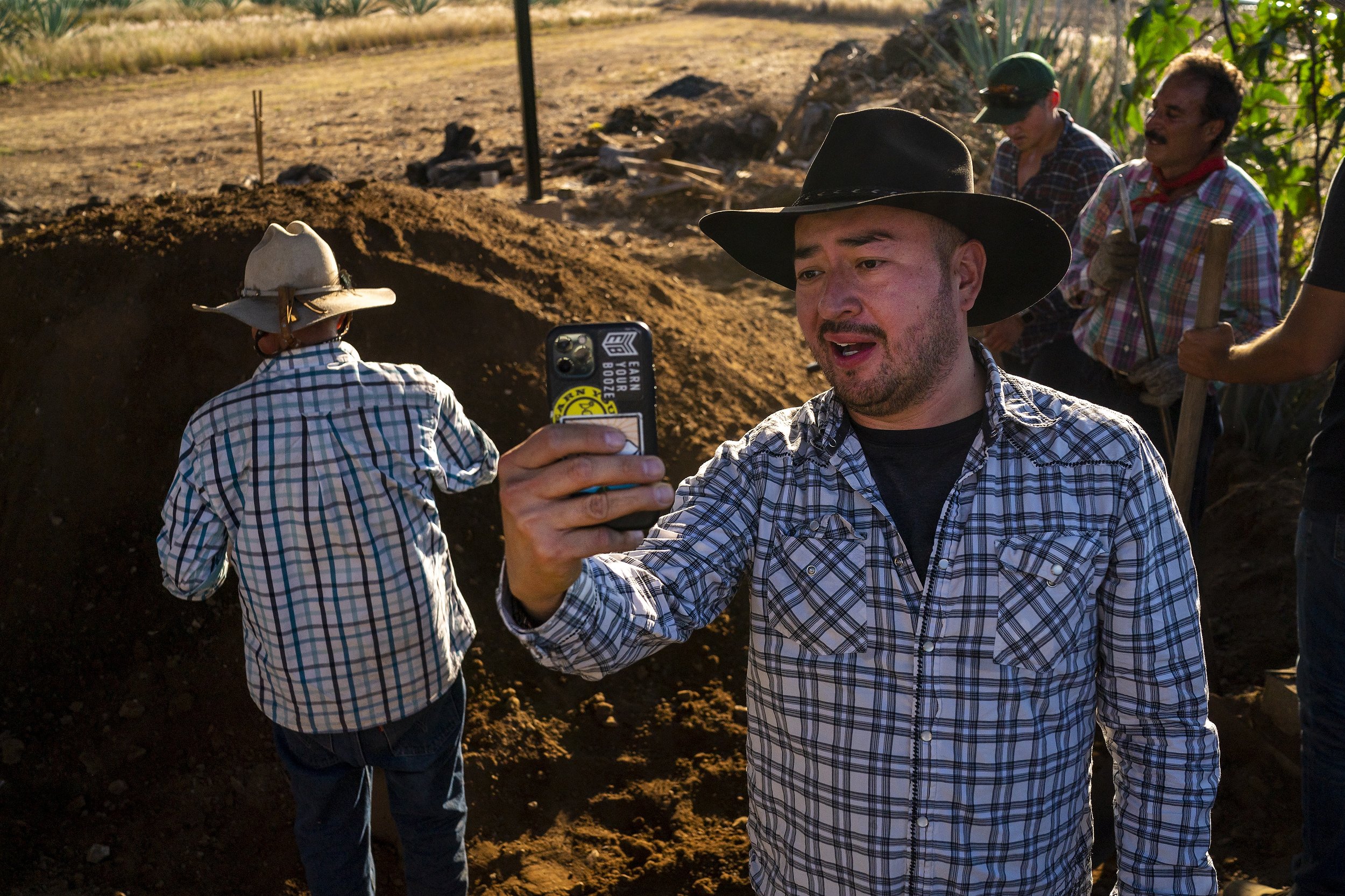  Iván Carreño records and Instagram video while working at Hacienda Carreño on Sunday, Dec. 6, 2021 in San Dionisio Ocotlán, Oaxaca, Mexico. Carreño regularly shares his company's group trips from Arizona to Oaxaca for people who want to learn more a