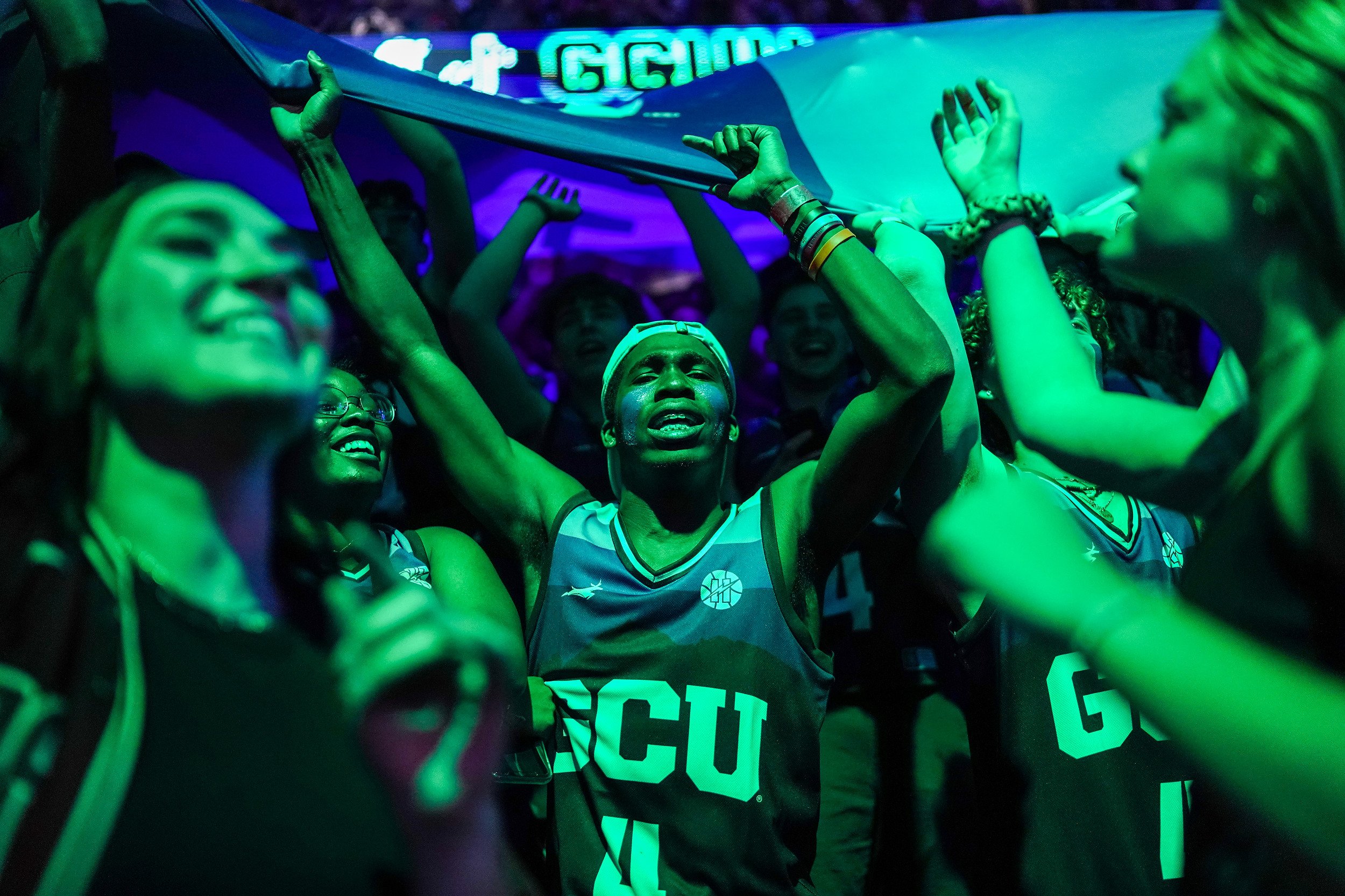  Levi Gue, at center, cheers with Grand Canyon University students dressed in Halloween costumes as they wait for the start of the first half against Western New Mexico University at Grand Canyon University Arena on Saturday, Oct. 30, 2021, in Phoeni
