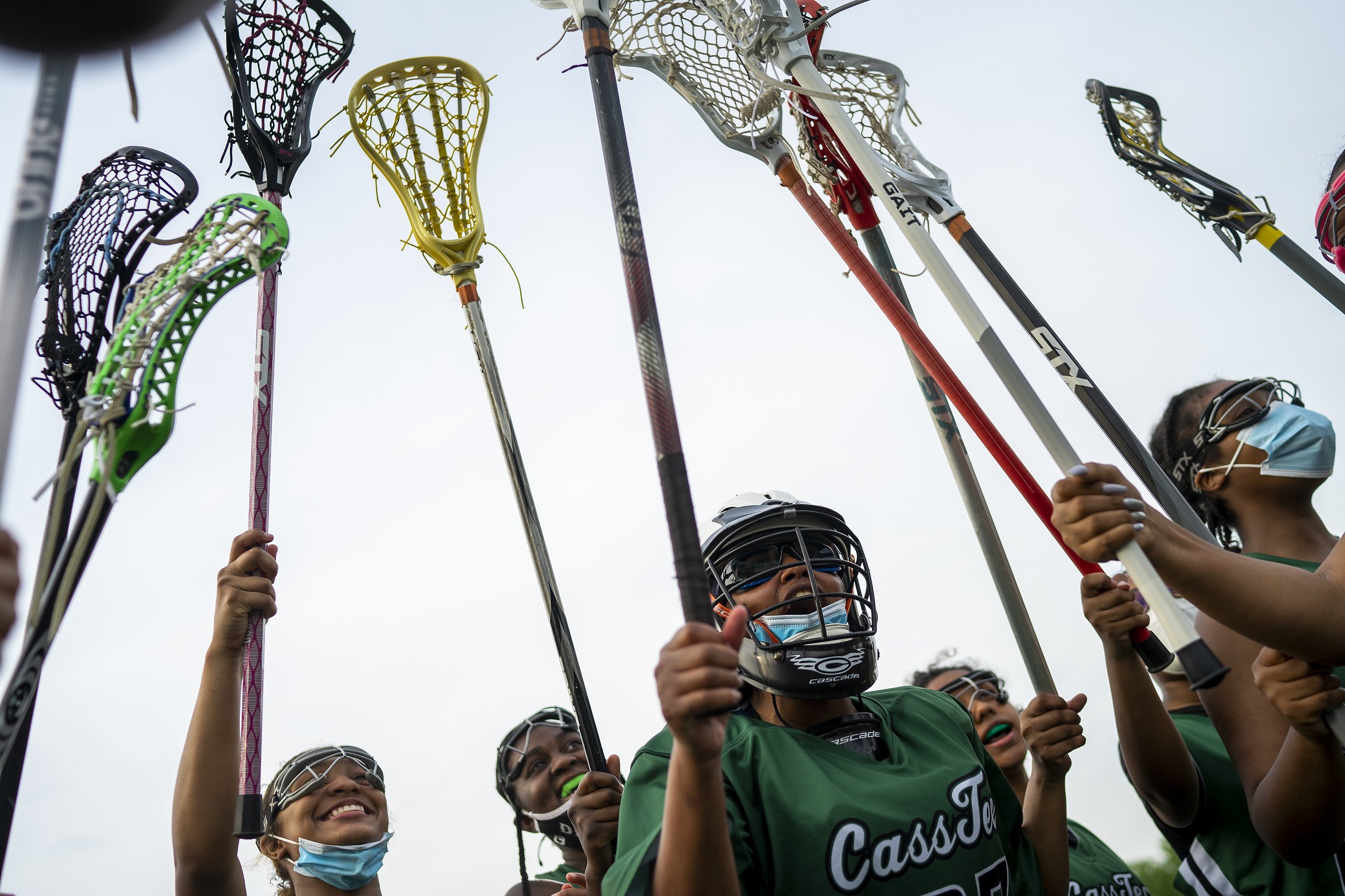  The Case Tech girls lacrosse team chant before the start of a pre-regional match against West Bloomfield High School on Thursday, May 20, 2021 in West Bloomfield.  