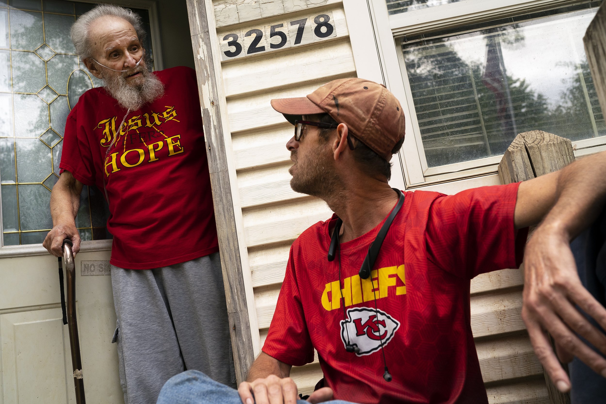  Daryel Miller, 80, left, emerges from his home to speak with his son Daryel Franklin Miller, 50, on Tuesday, September 20, 2022, in Excelsior Springs, Mo.  