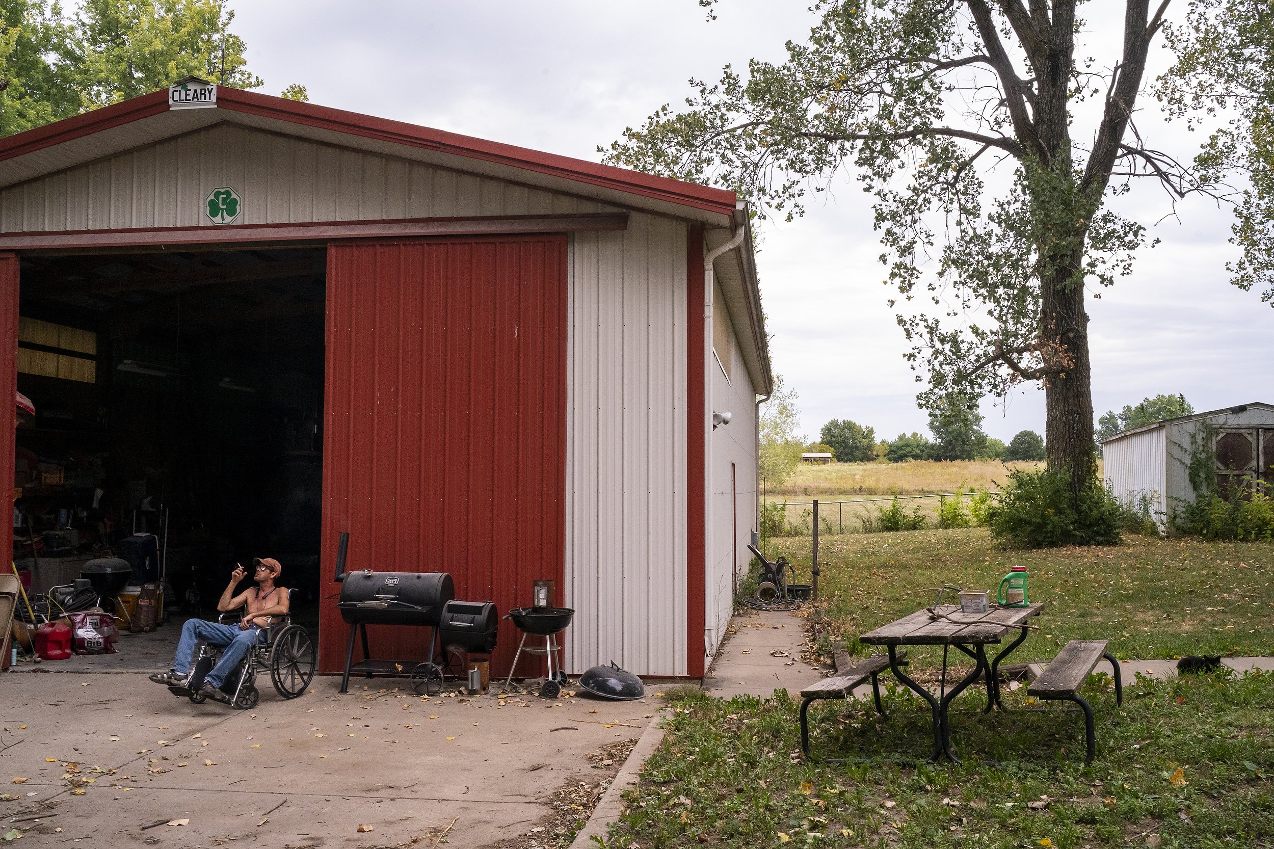  Daryel Franklin Miller, 50, sits in a wheelchair that belonged to his grandmother as he spends the day smoking deer roasts and meatloaf for his father and step-mother while smoking and drinking at his father's home on Wednesday, September 21, 2022, 