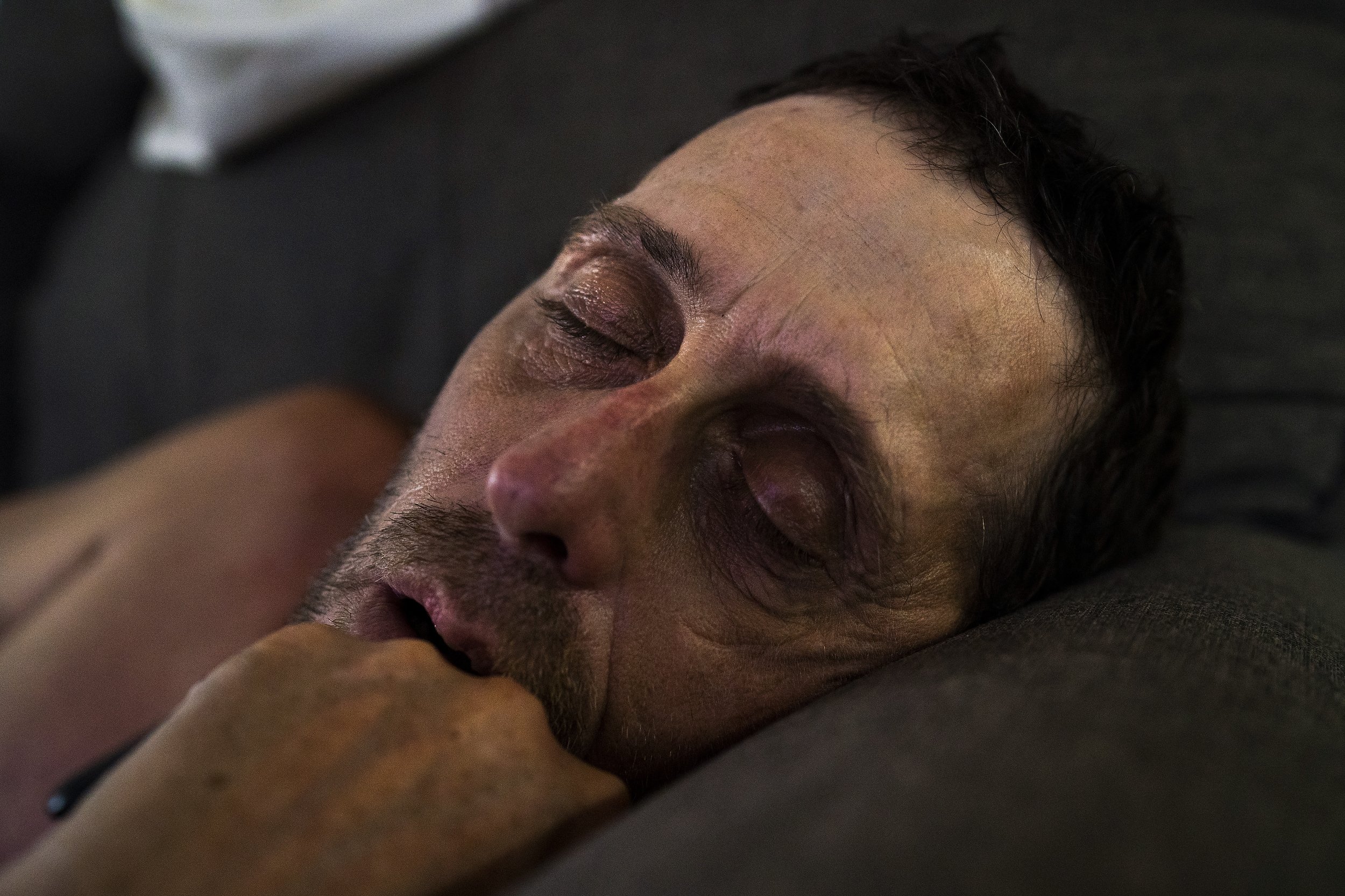  Daryel Franklin Miller, 50, lays passed out on the couch after a day of drinking. 