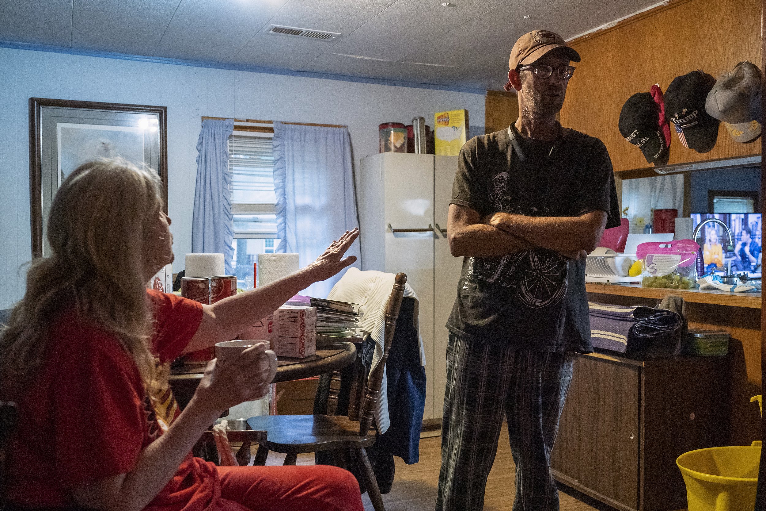  Theresa Ann Miller, 68, at left, tries to console her stepson Daryel Franklin Miller, 50, at right, about taking out the trash at her home on Friday, September 23, 2022, in Excelsior Springs, Mo. Daryel spoke about the emotional complications he fac