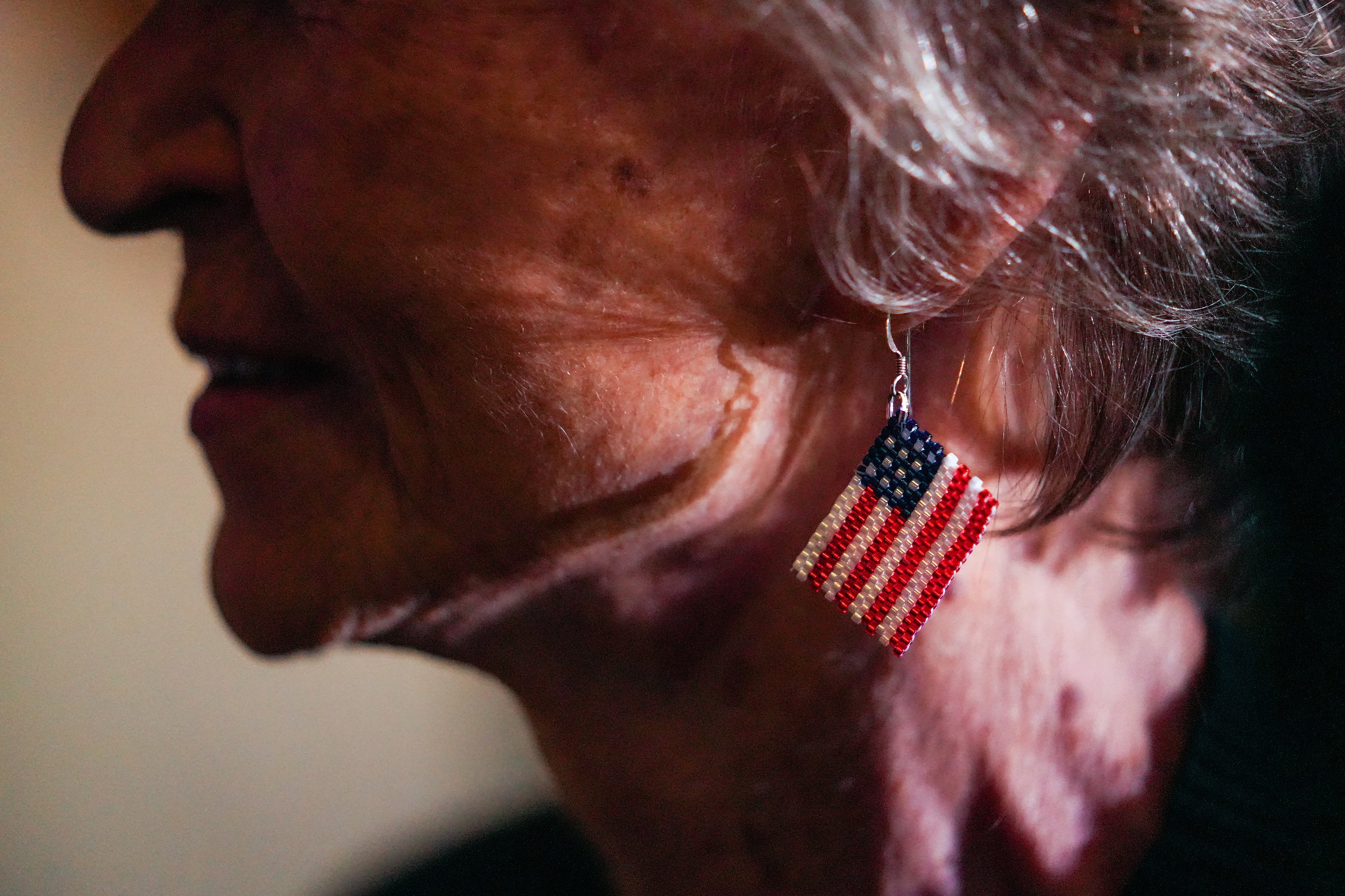  Adria Ortiz wears an American flag earring during a democratic candidates Election Night watch party at the Renaissance Phoenix Downtown Hotel on Tuesday, Nov. 8, 2022, in Phoenix. 