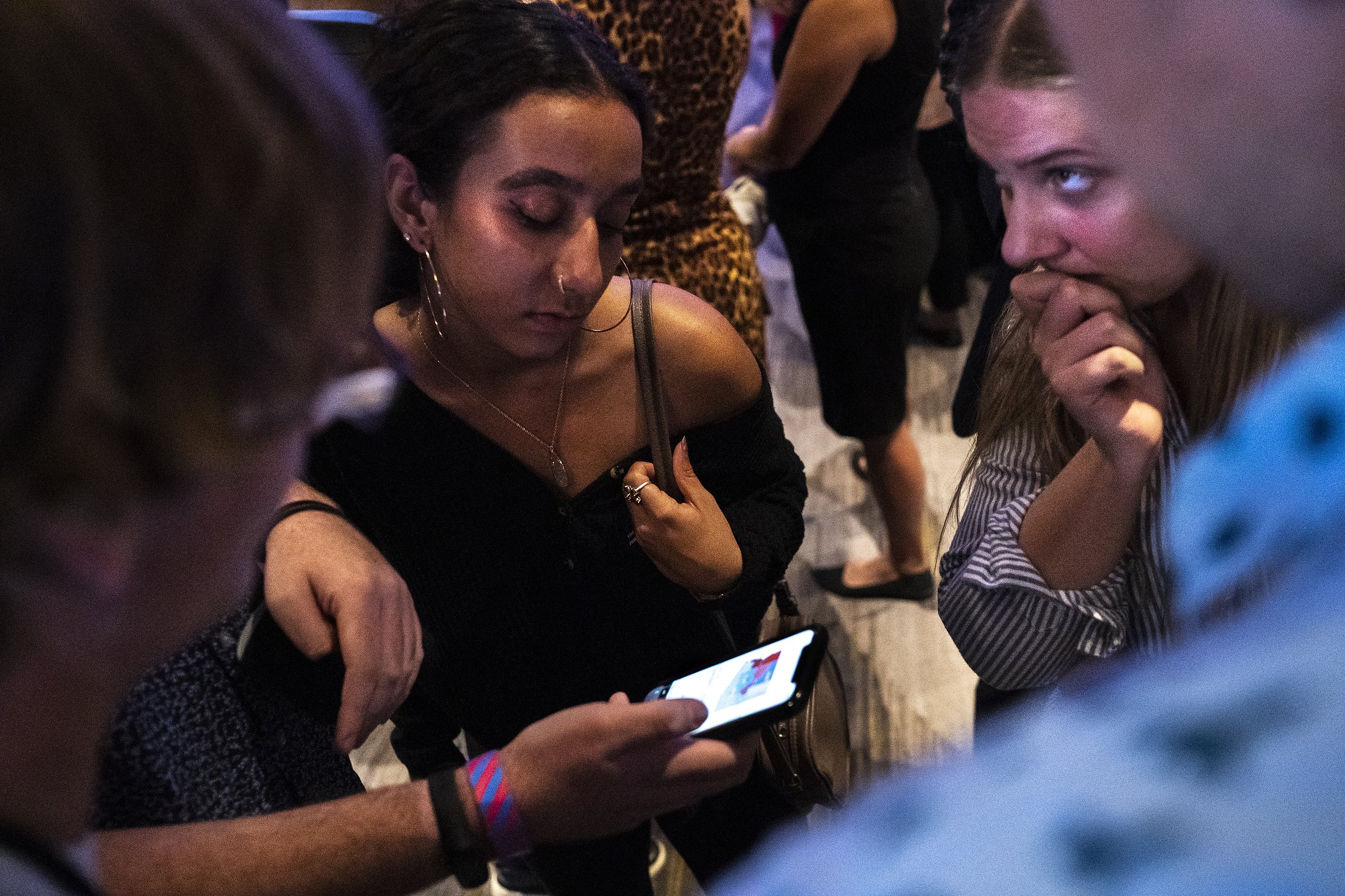  Sahara Sajjadi, at center, and Kaliee Heyman, at right, watch as election results come in during a democratic candidates Election Night watch party at the Renaissance Phoenix Downtown Hotel on Tuesday, Nov. 8, 2022, in Phoenix. 