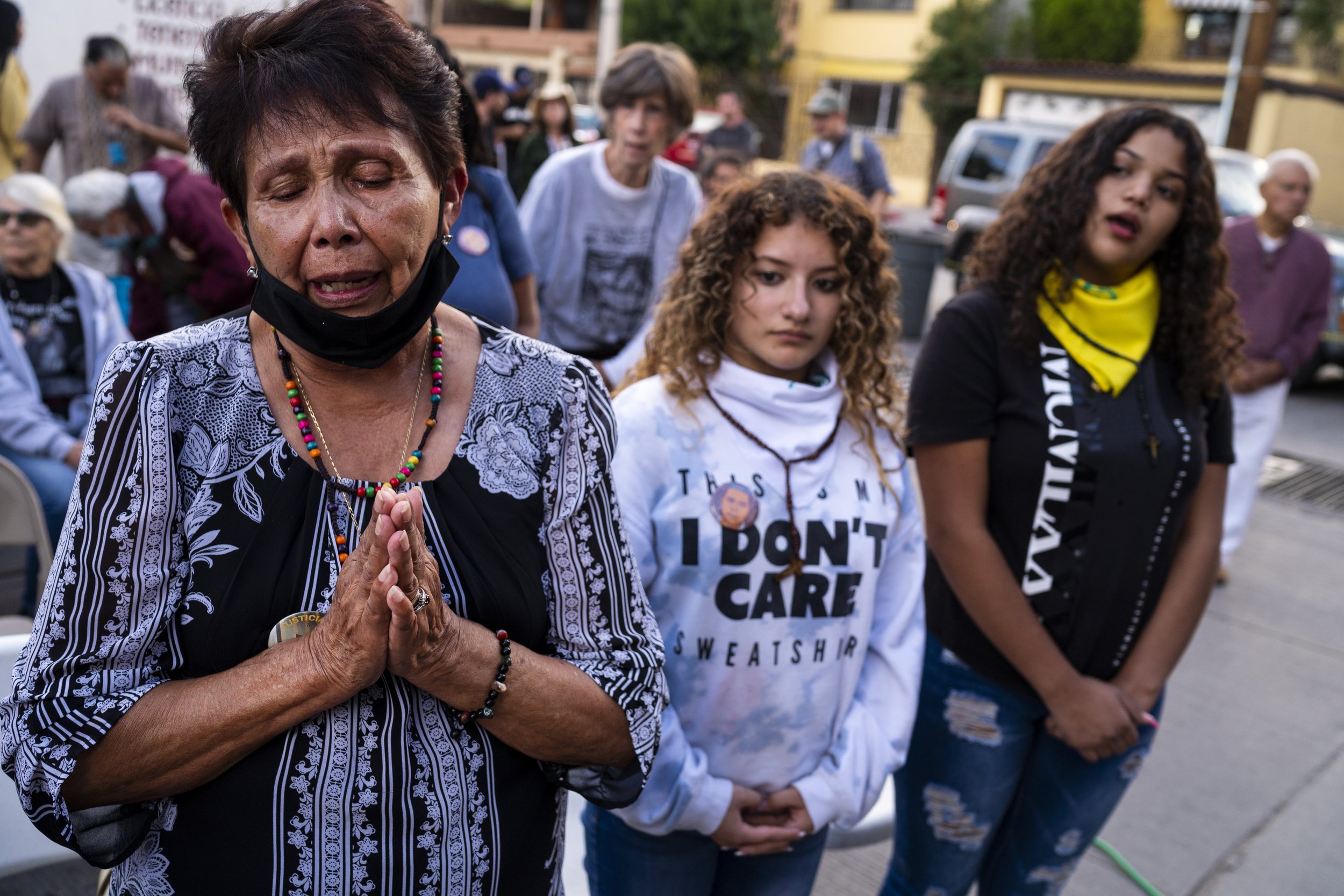  Taide Elena, at left, sheds tears as she, Astrid Elena Espinoza, 18, at center, and Andrea Elena Rodriguez, 18, at right, pray during a mass to honor her grandson and their cousin, respectively, Jos Antonio Elena Rodrguez on the 10-year anniversary