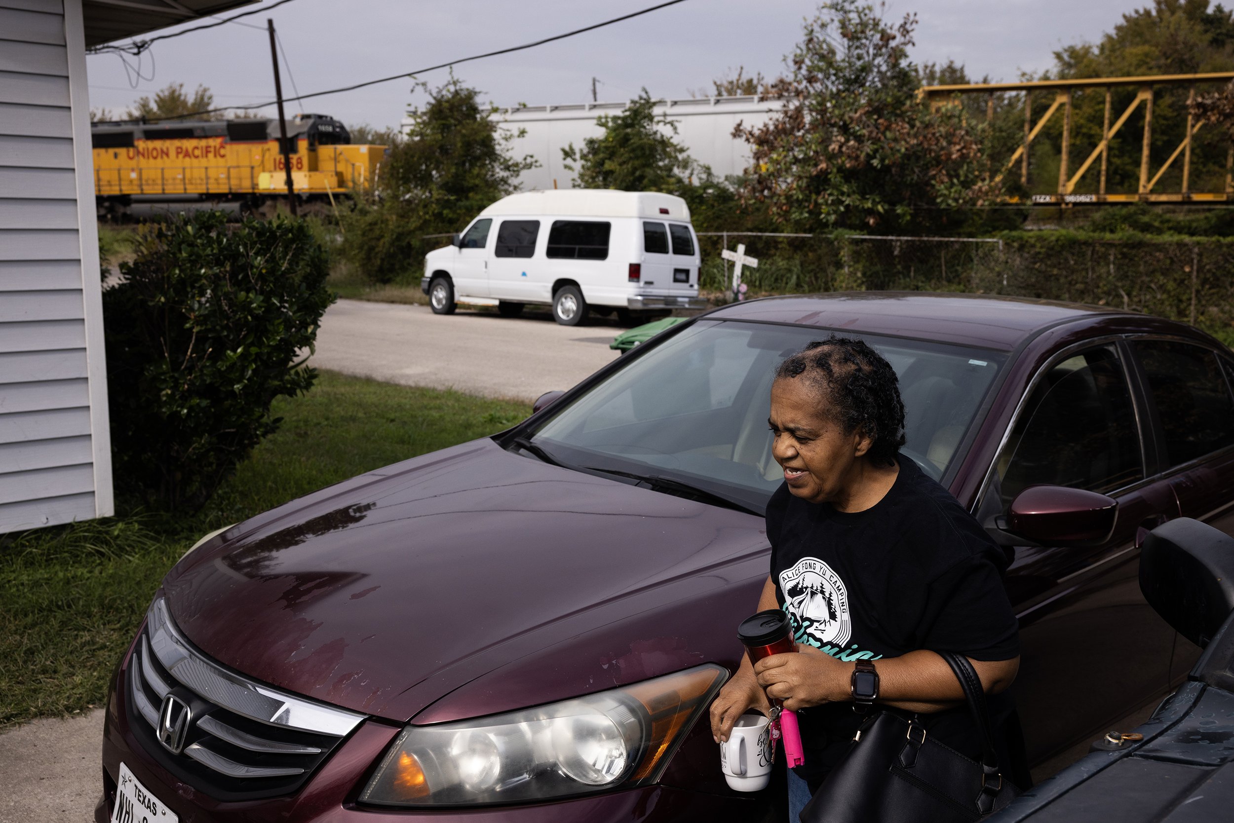  Sandra Auzenne returns from a doctors appointment as a Union Pacific train passes across the street, Wednesday, Nov. 29, 2023, in Houston. “If I had known about all this before, if someone had told me, I would have never moved in here,” Auzenne said