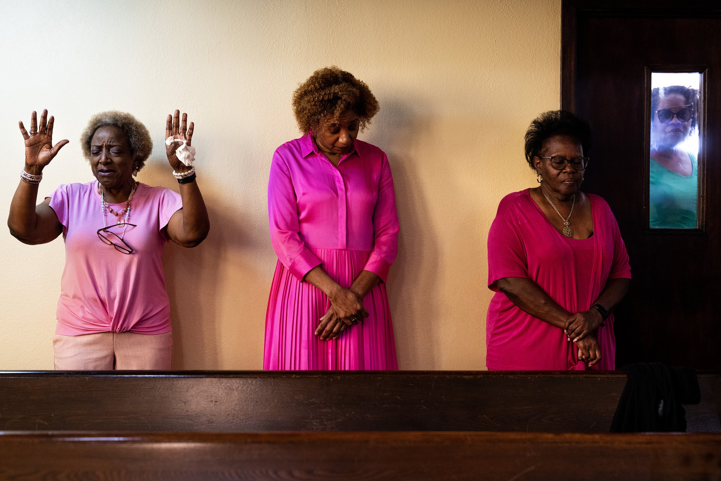  From left, Joetta Stevenson cries as Annette Sims and Holly Bennett stand in prayer during service at Mt. Vernon United Methodist Church, Sunday, Sept. 10, 2023, in Houston.  