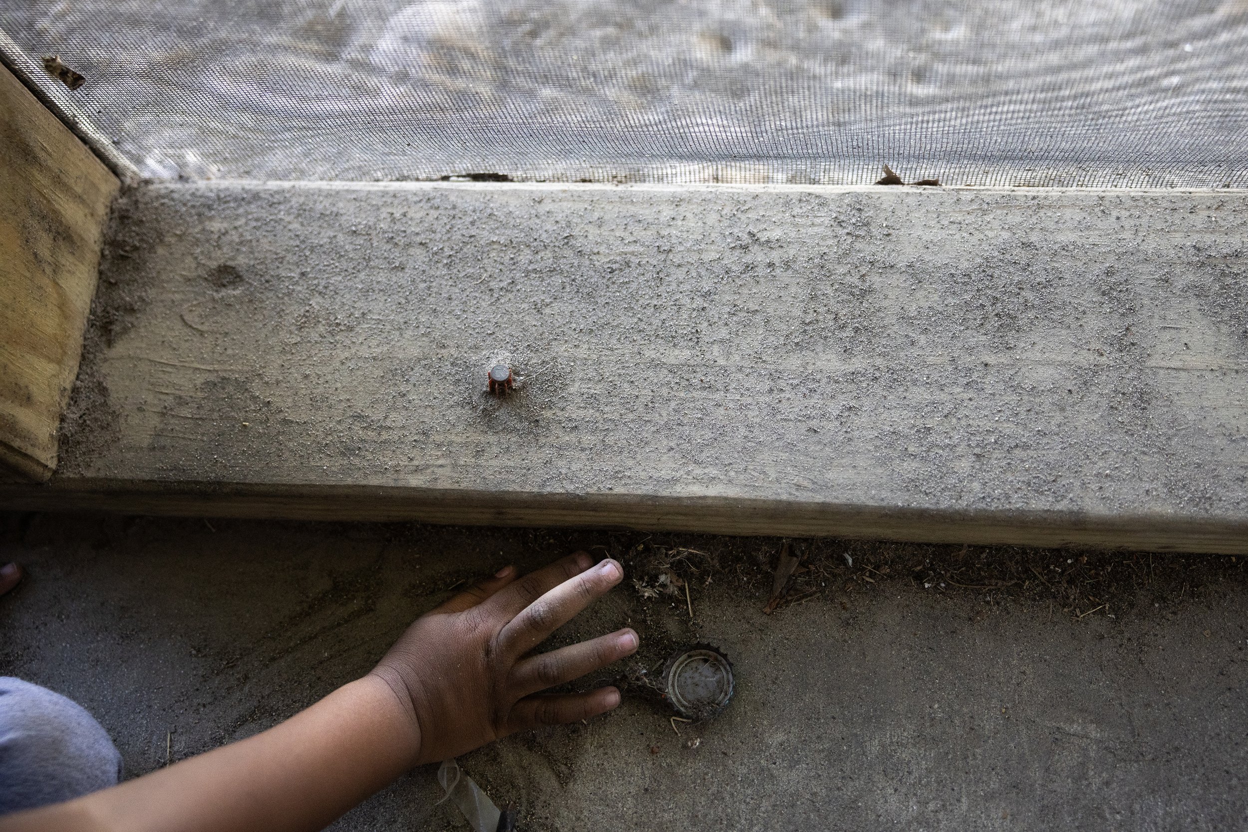  Carson, the grandson of Carl Portis, a New Orleans transplant, plays in the dirt at his neighbors home, Wednesday, Oct. 18, 2023, in Houston. Portis moved to his house blocks away from a cancer causing former creosote plant after his home was destro