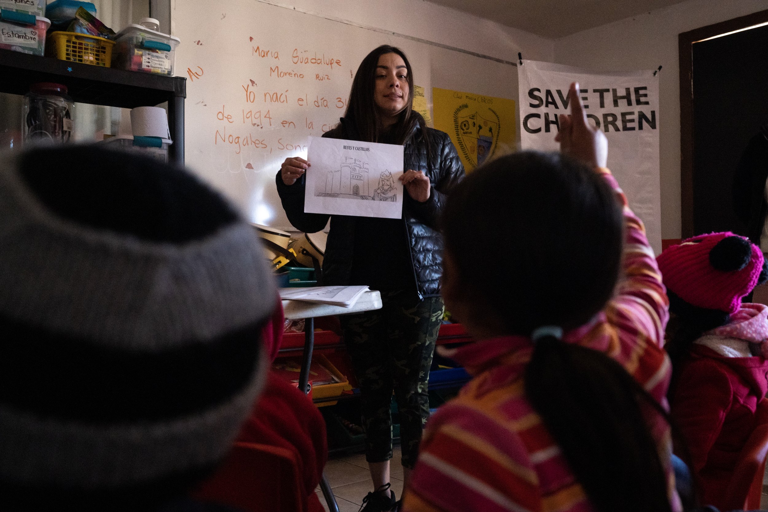  Maria Guadalupe Morena Ruiz asks a question to the class during a history class for migrant children staying at La Casa de Misericordia on Friday, Jan. 7, 2023, in Nogales, Mexico. 