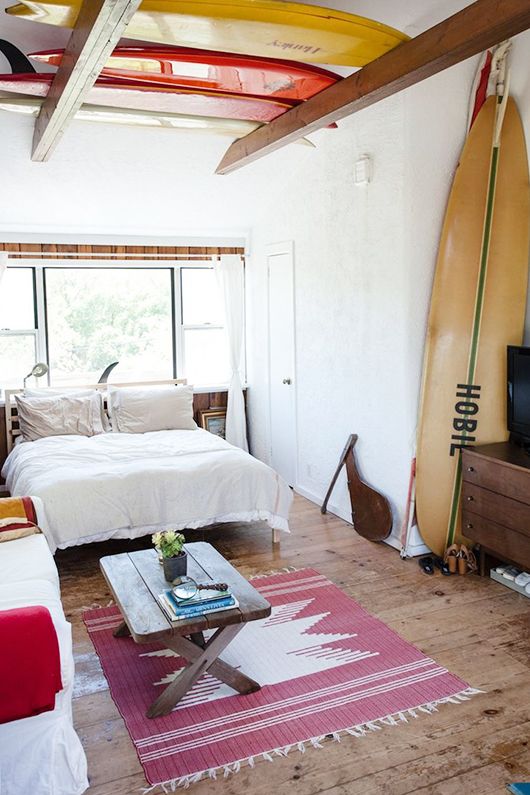   Mikey DeTemple' s oceanside hideaway in Montauk, NY packed with old beach treasures including several vintage boards.&nbsp;Photos: Zak Bush. 