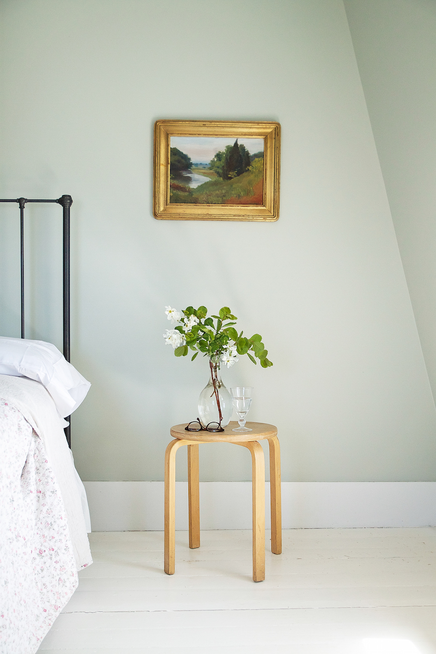  A bedroom in Julie Carlson's Cape Cod cottage painted Cromarty. 