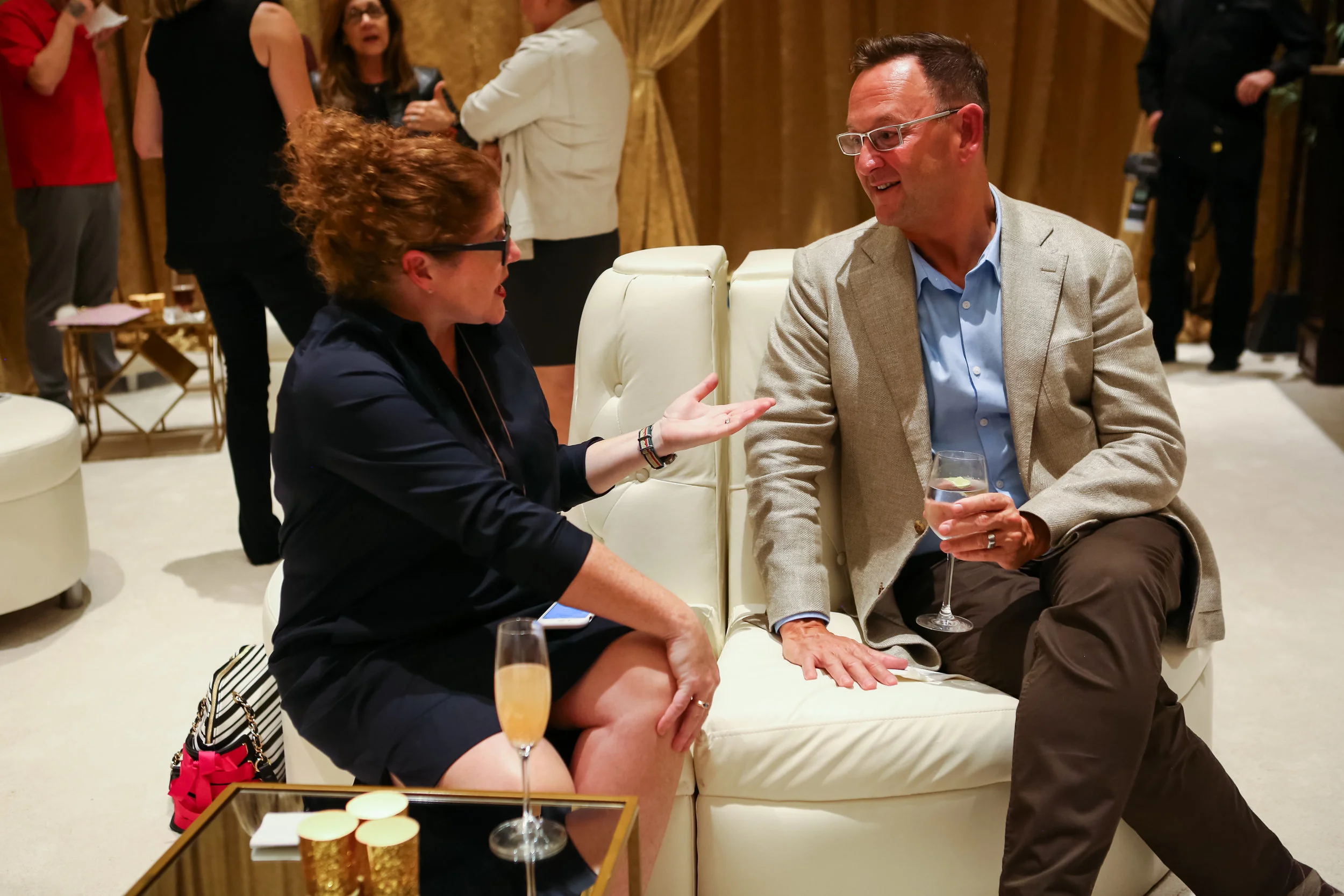 I did not lie on the carpet but I do love me a bellini and a catchup with the always sharply dressed Jeffrey Johnson from Dallas. photo by Felix O.B/ FXO Photography