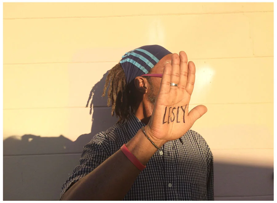A rare shot of Lesly with his name penned onto his palm.