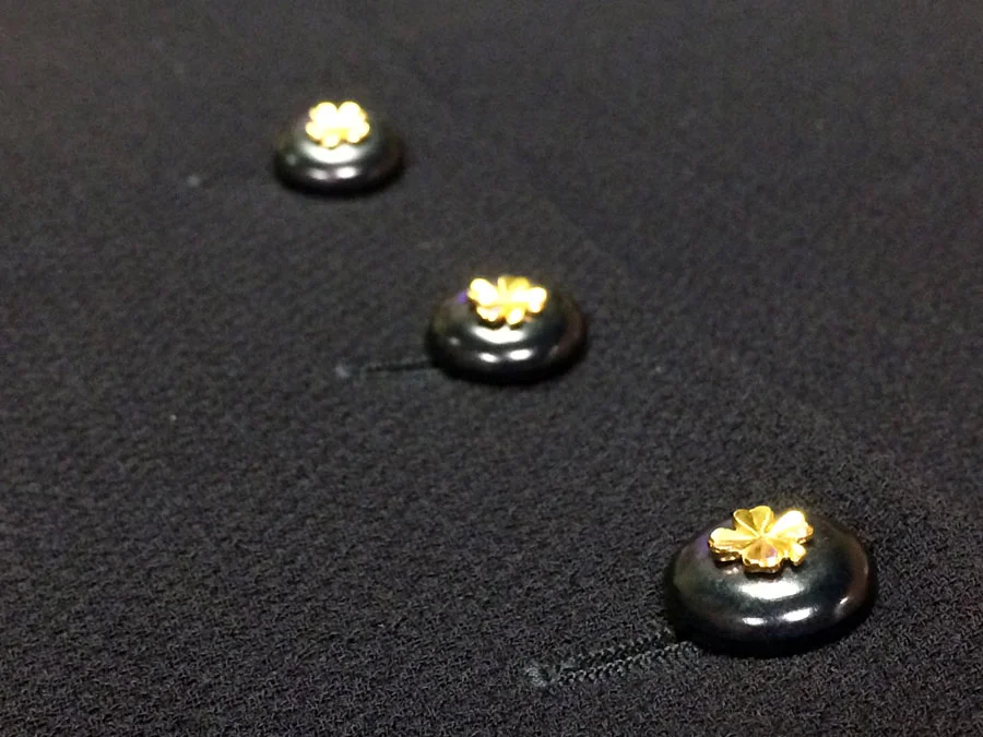 Lucky Charms. It's all in the details of this skirt. Black celluloid buttons decorated with gold-tone shamrock featured at back hemline. Skirt, vintage Chanel.