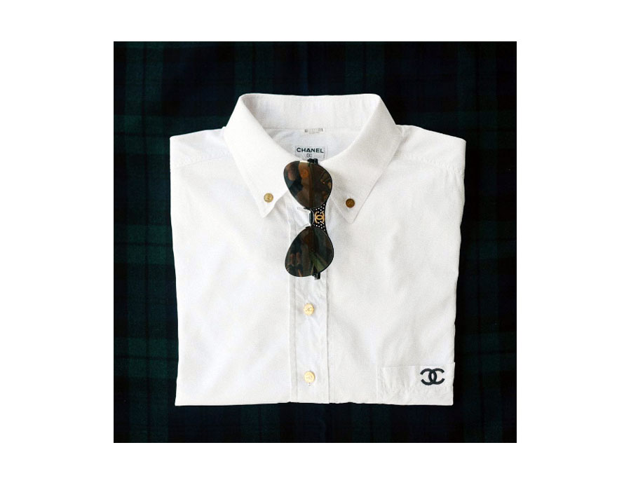 Classic 100% cotton button-down with CC embroidered pocket, Sunnies with perforated metal accent. 