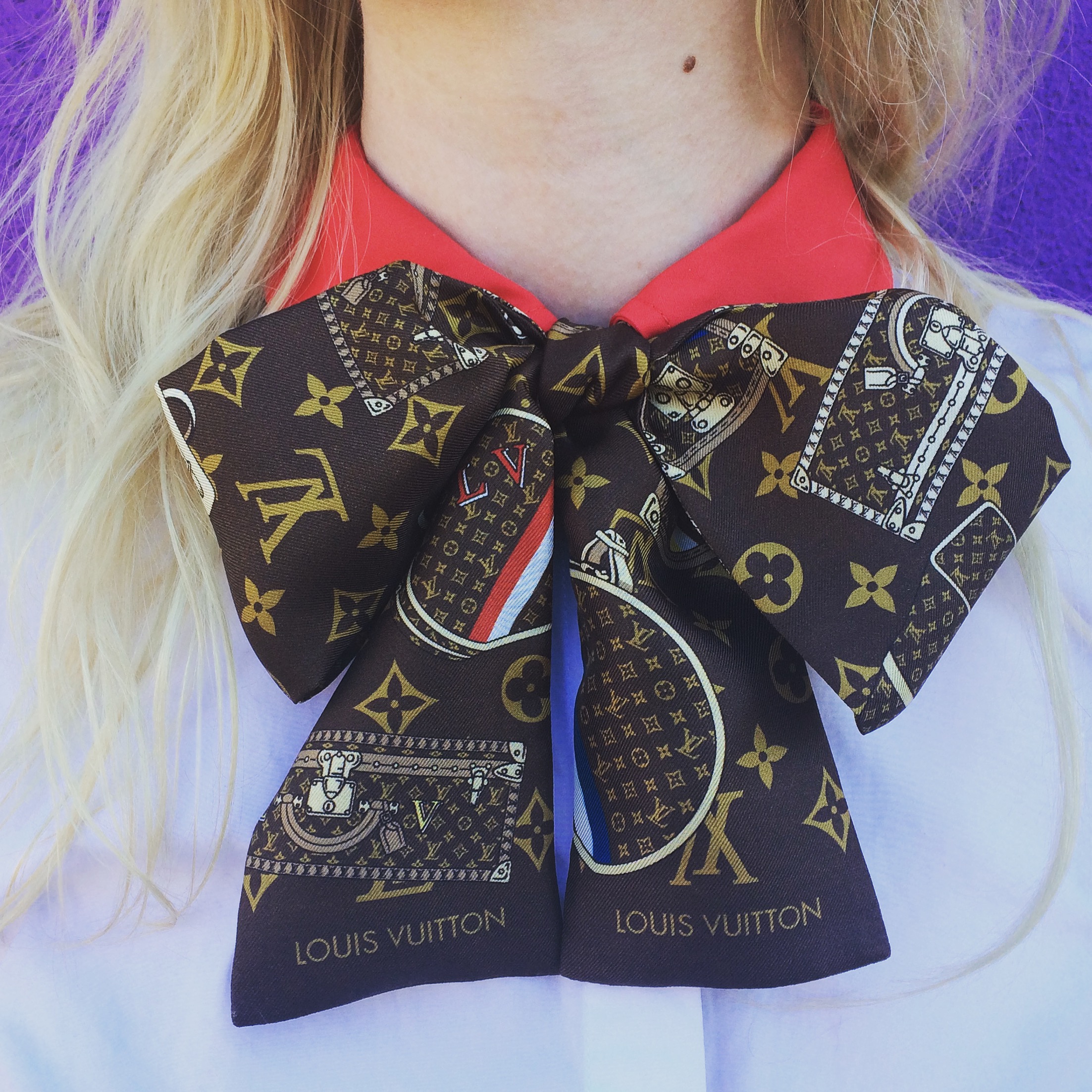 Bow wow. SIlk Bandeau Twilly Scarf by Louis Vuitton . Red collar contrast blouse by Tory Burch .