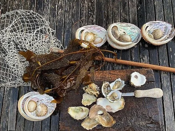 Rustic island dining moment showcasing local produce and ocean views